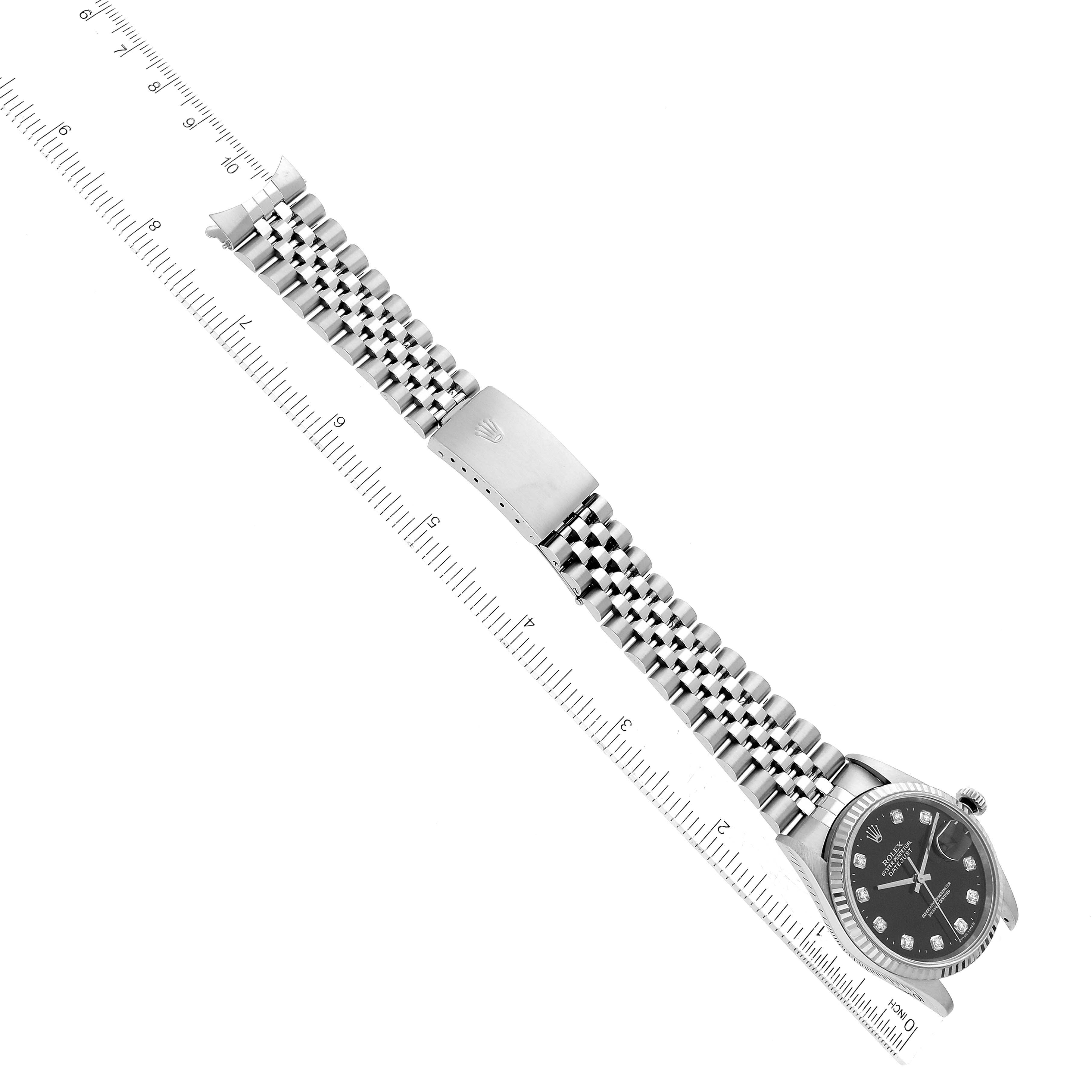 The Rolex Datejust 16234G Men
s Stainless Steel Black Dial 16234G Men
s Stainless Steel Black Dial watch is shown from above, highlighting the face, bracelet, and clasp.