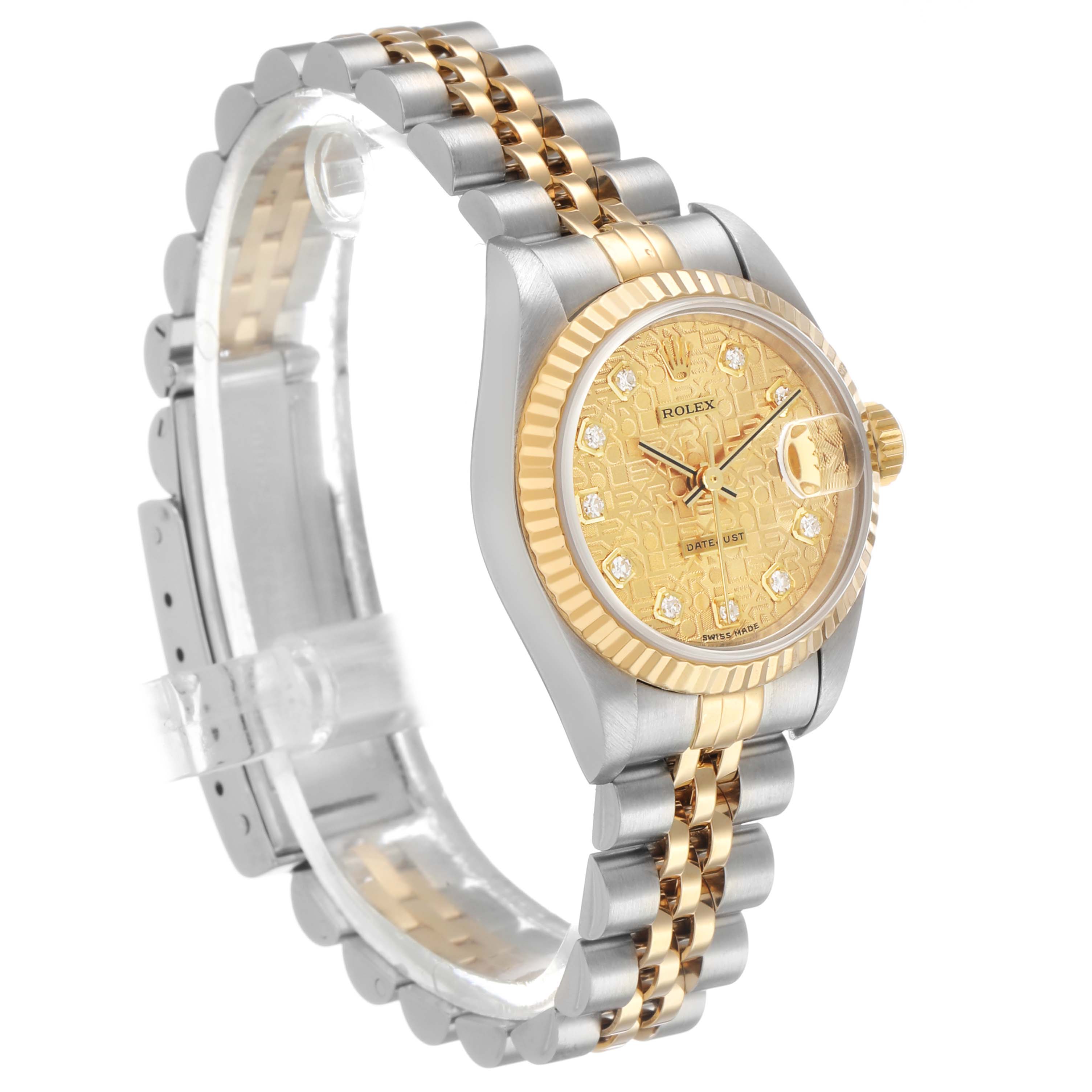 The Rolex Datejust 79173 Women's Steel and Gold (two tone) Champagne Dial watch is shown at a three-quarter angle, highlighting the gold dial, fluted bezel, and two-tone bracelet.