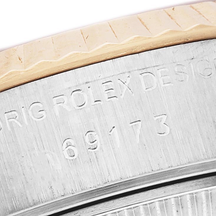 The image shows a close-up of the case side engraving on a Rolex Datejust 69173 Women
s Steel and Gold (two tone) Champagne Dial 69173 Women
s Steel and Gold (two tone) Champagne Dial, displaying the model number.