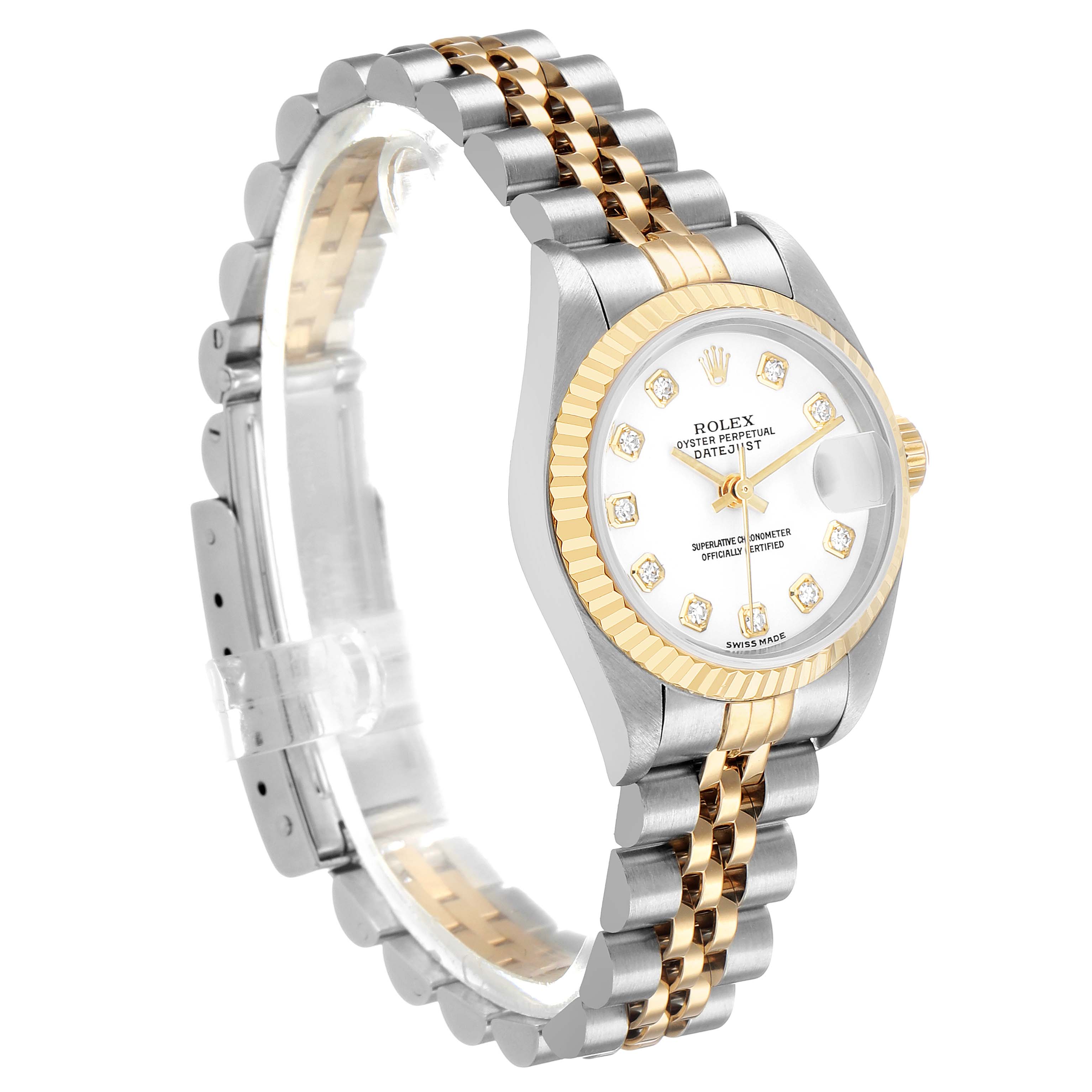 The Rolex Datejust 79173 Women's Steel and Gold (two tone) White Dial watch is shown at a three-quarter angle, highlighting the gold and silver bezel and Jubilee bracelet.