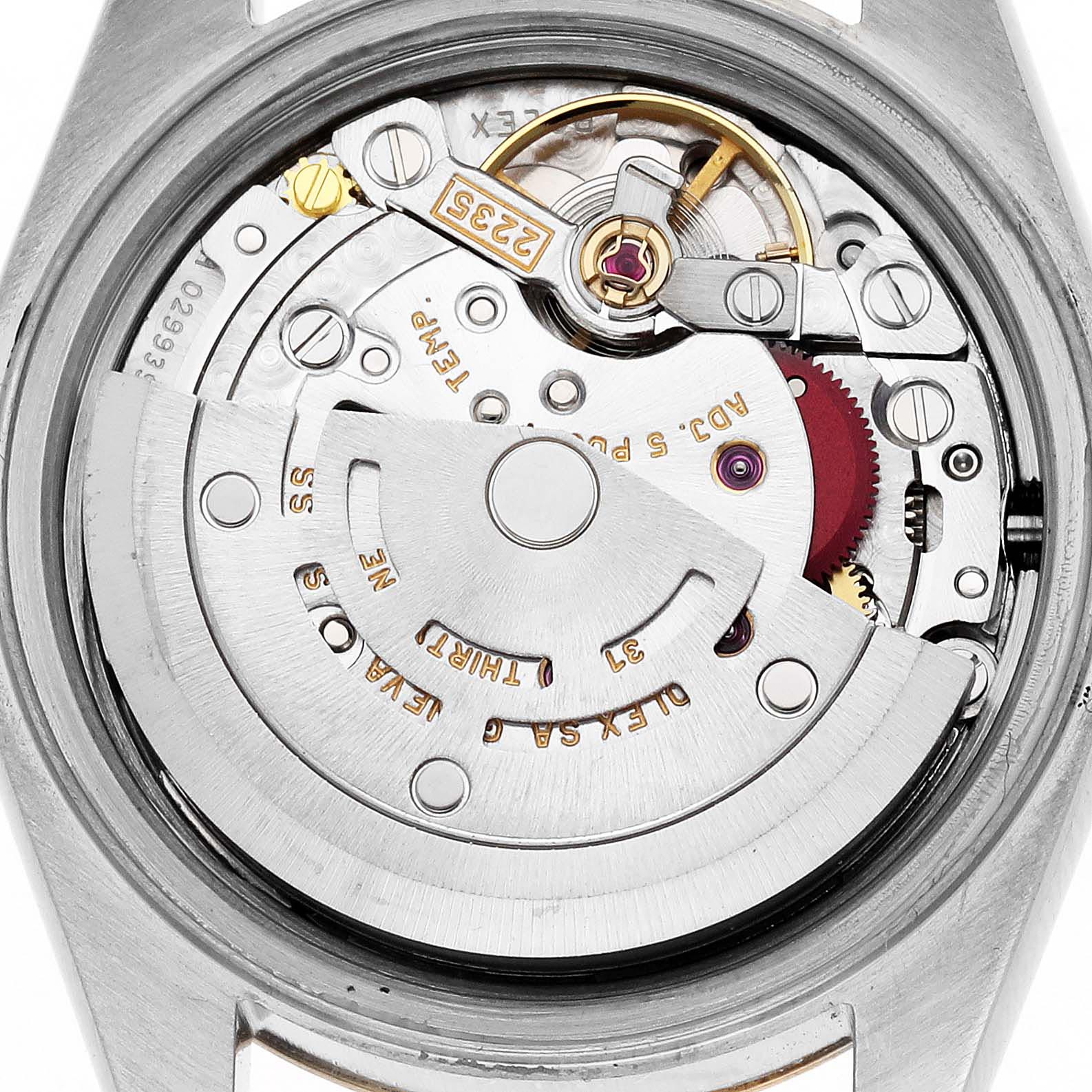 The image shows the movement of a Rolex Datejust 79173 Women
s Steel and Gold (two tone) White Dial 79173 Women
s Steel and Gold (two tone) White Dial watch from the back, highlighting its intricate mechanical parts.