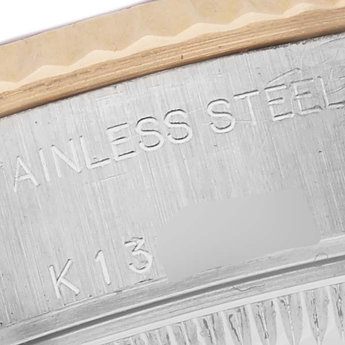 The image shows a close-up of the side engravings on a Rolex Datejust 79173 Women
s Steel and Gold (two tone) White Dial 79173 Women
s Steel and Gold (two tone) White Dial bezel, highlighting "STAINLESS STEEL".