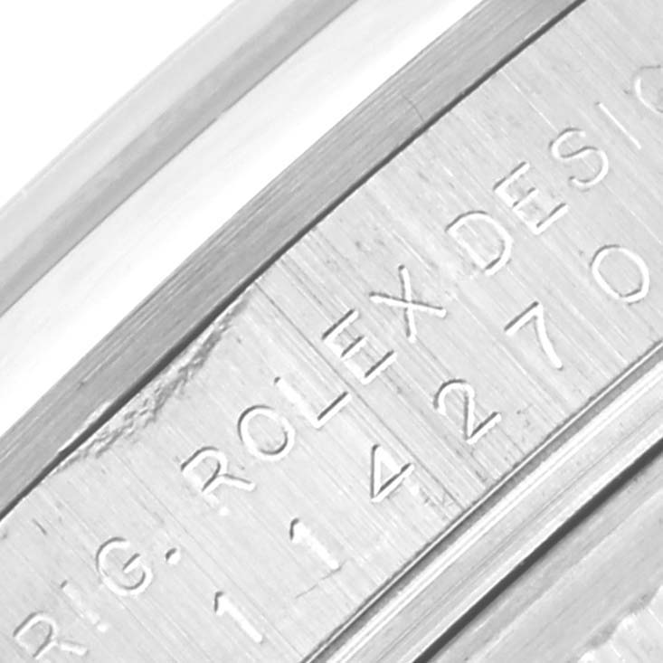 This image shows a close-up of the engraved inner bezel of a Rolex Explorer 114270 Men
s Stainless Steel Black Dial 114270 Men
s Stainless Steel Black Dial watch.