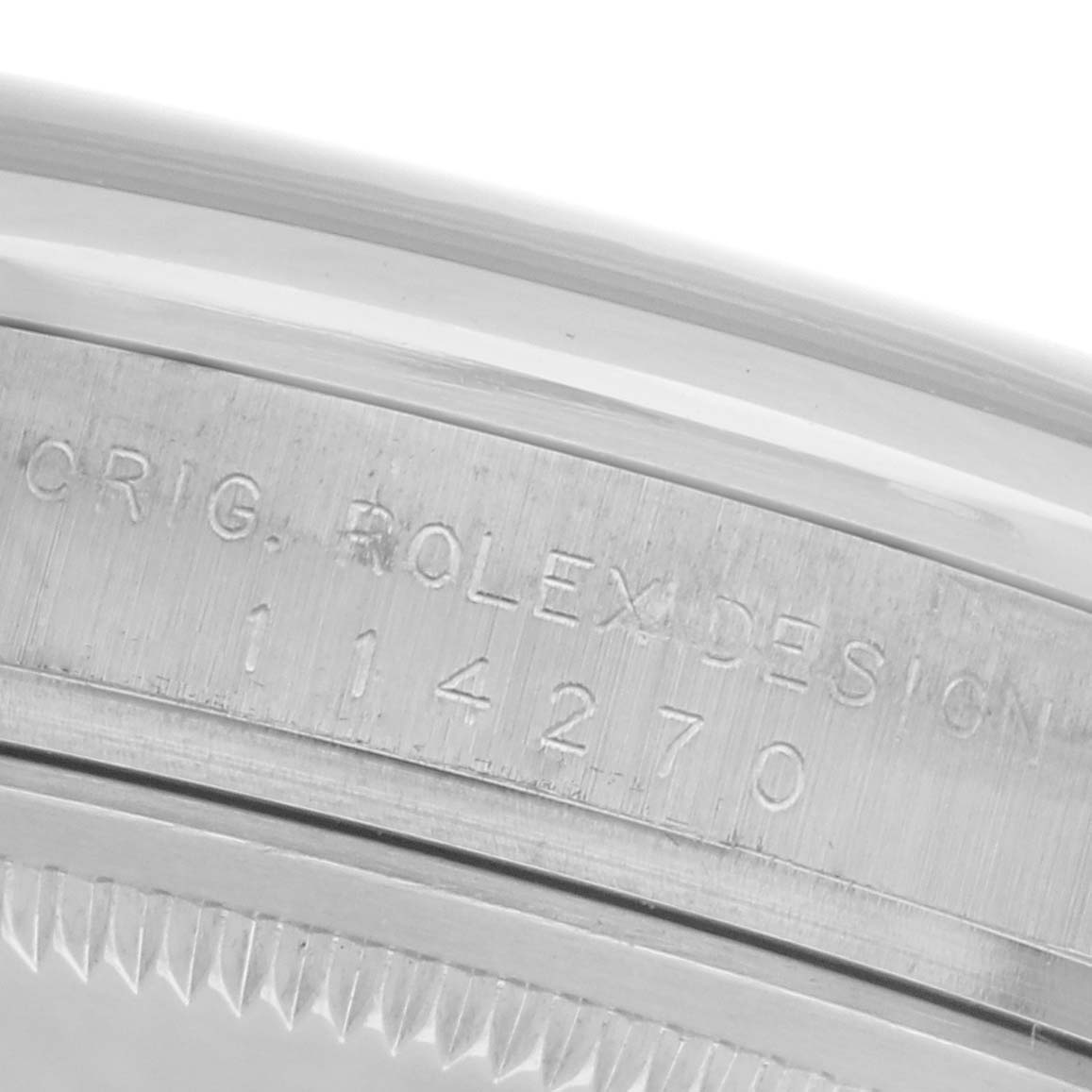 The image shows a close-up of the side of the Rolex Explorer 114270 Men
s Stainless Steel Black Dial 114270 Men
s Stainless Steel Black Dial watch with engraved model details.