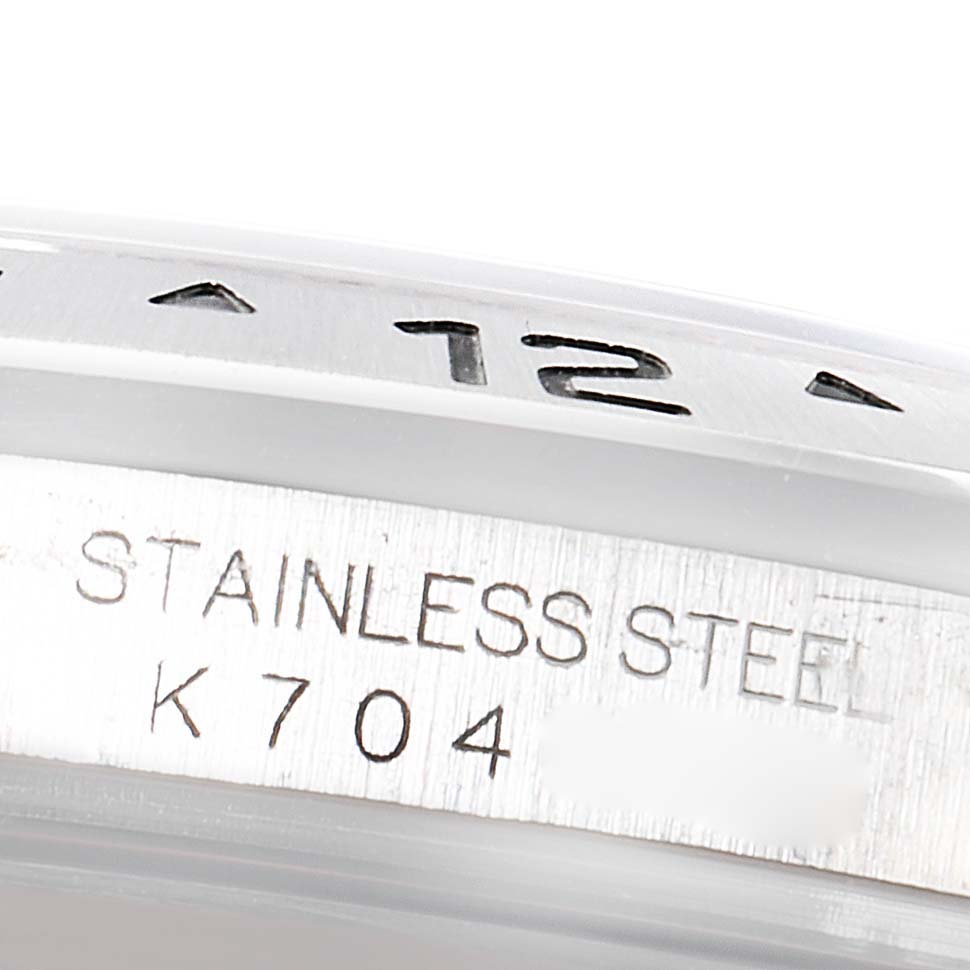 This close-up image shows the stainless steel bezel and part of the casing with engravings of the Rolex Explorer 16570 Men's Stainless Steel Black Dial 16570 Men's Stainless Steel Black Dial watch model.