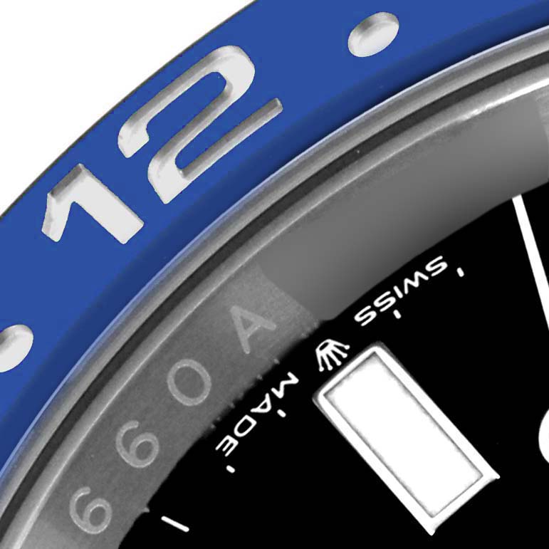 The image shows a close-up of the bezel and part of the dial of a Rolex GMT-Master 126710BLNR Men
s Stainless Steel Black Dial 126710BLNR Men
s Stainless Steel Black Dial watch.
