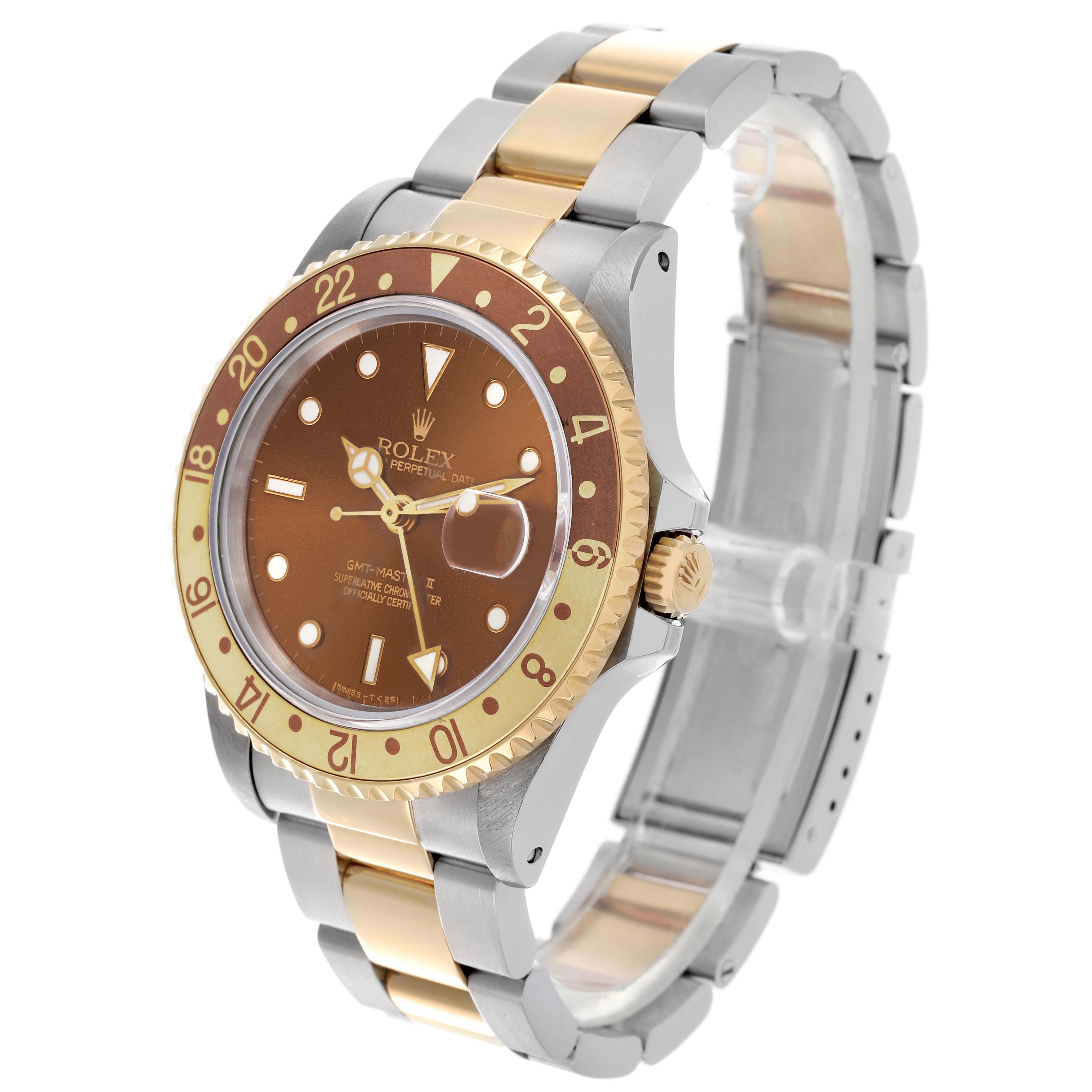 The Rolex GMT-Master 16713 Men
s Steel and Gold (two tone) Brown Dial 16713 Men
s Steel and Gold (two tone) Brown Dial watch is shown at a three-quarter angle, displaying the bezel, dial, and bracelet.