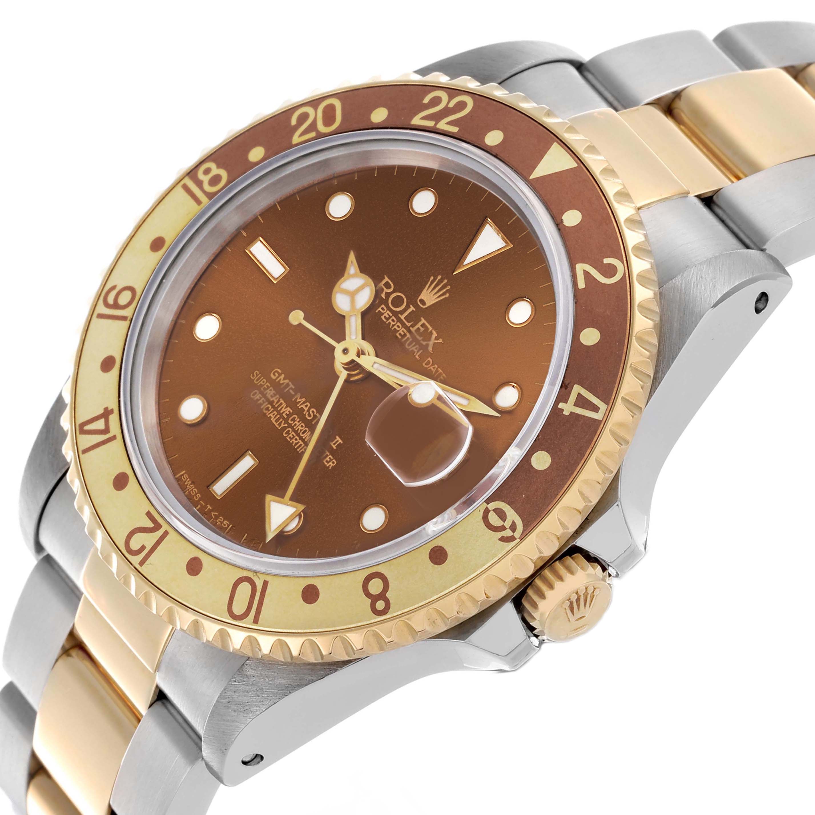 The Rolex GMT-Master 16713 Men
s Steel and Gold (two tone) Brown Dial 16713 Men
s Steel and Gold (two tone) Brown Dial watch is shown at an angled close-up, highlighting the bezel, crown, and bracelet.