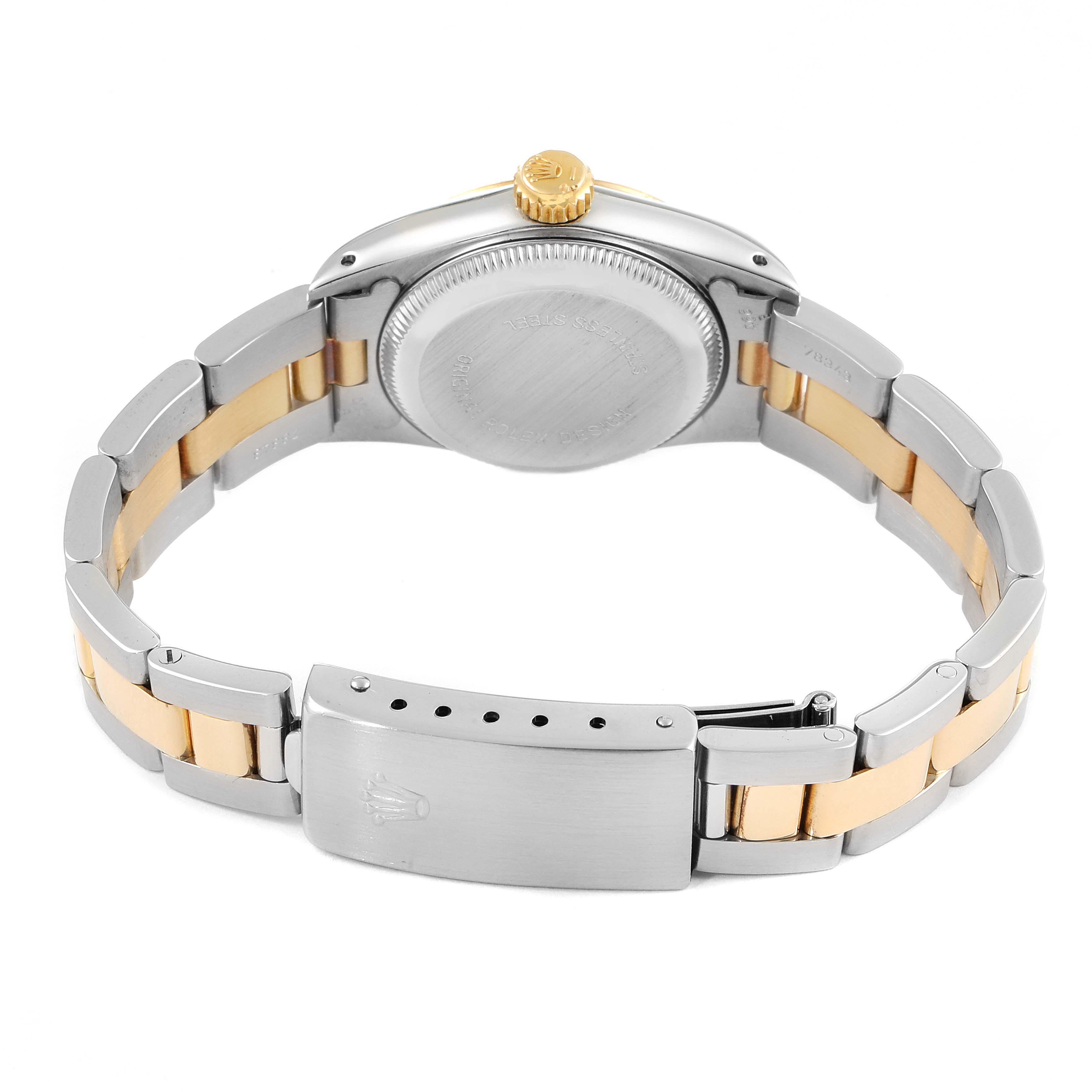 The image shows the back case and clasp of a Rolex Oyster Perpetual 67193 Women
s Steel and Gold (two tone) Champagne Dial 67193 Women
s Steel and Gold (two tone) Champagne Dial watch from a slightly elevated rear angle.