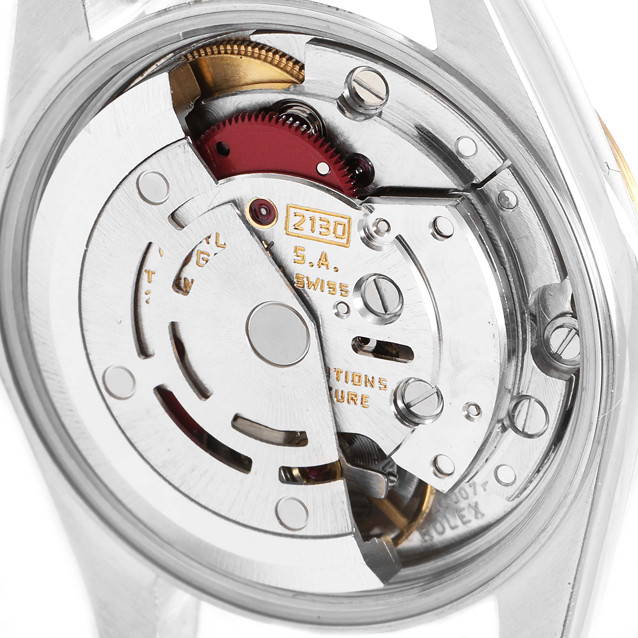 This is a close-up view of the internal movement mechanism of a Rolex Oyster Perpetual 67193 Women
s Steel and Gold (two tone) Champagne Dial 67193 Women
s Steel and Gold (two tone) Champagne Dial watch.