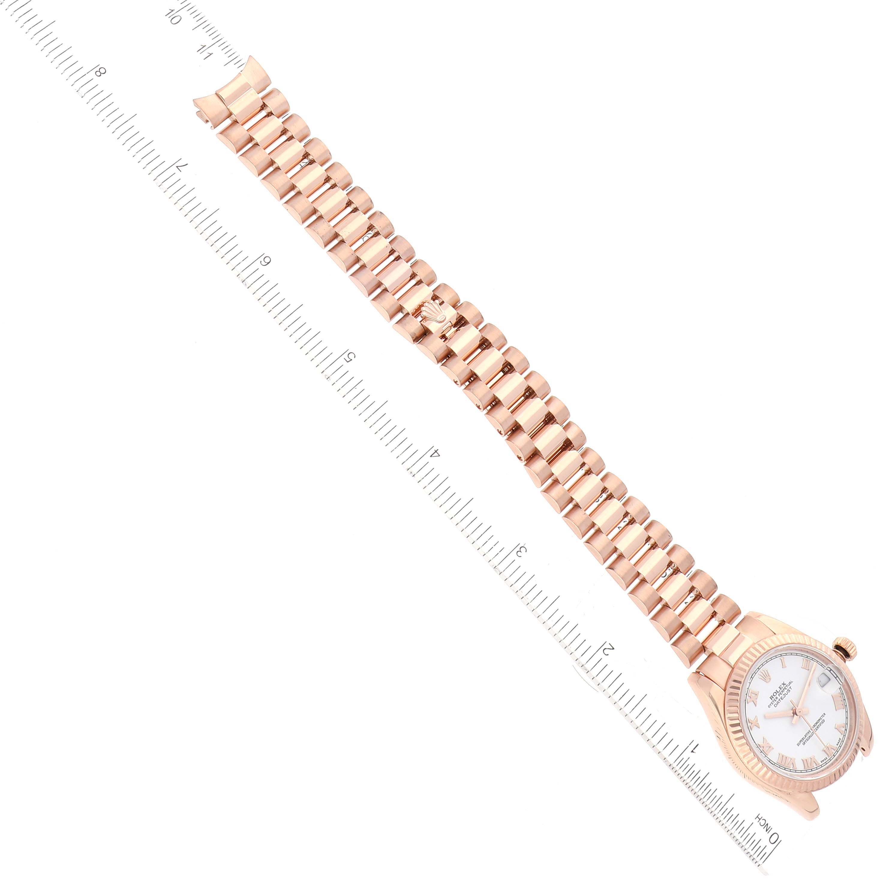 The image shows a Rolex President 178275 Women
s Rose Gold White Dial 178275 Women
s Rose Gold White Dial model watch angled diagonally, highlighting its bracelet and a portion of the face.