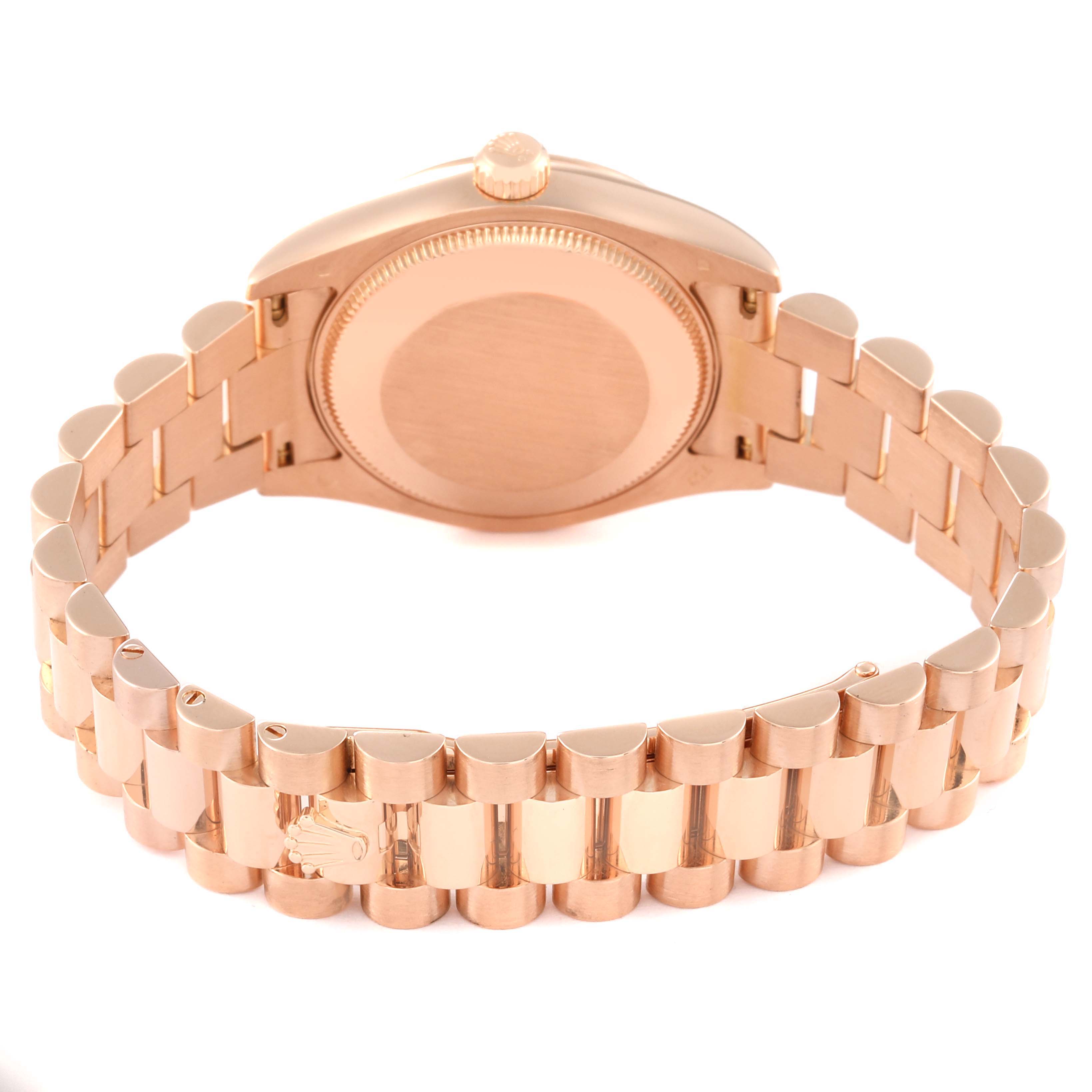 The Rolex President 178275 Women
s Rose Gold White Dial 178275 Women
s Rose Gold White Dial model watch is shown from the back, highlighting the case back and the bracelet.