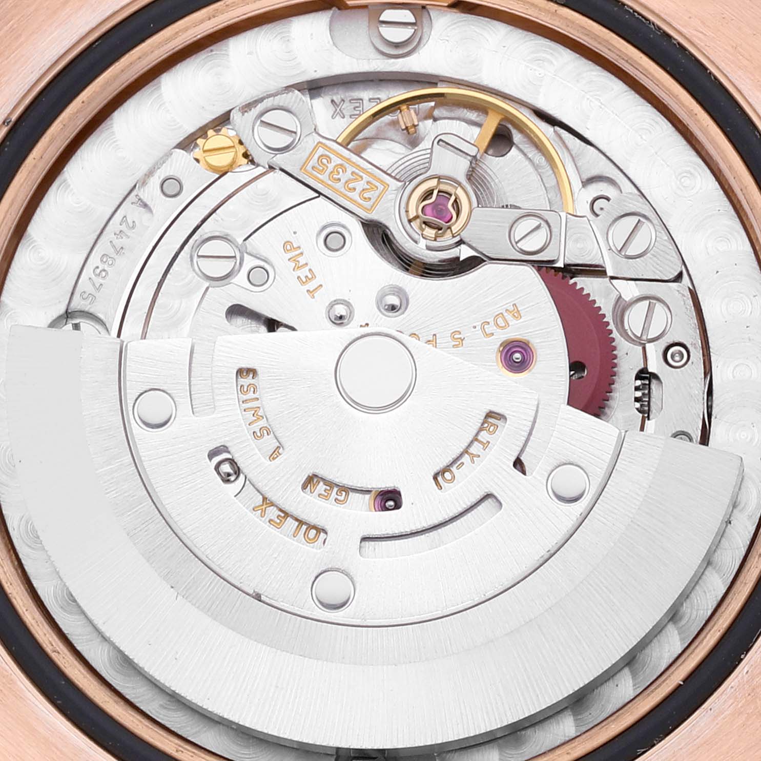 The image shows the movement of a Rolex President 178275 Women
s Rose Gold White Dial 178275 Women
s Rose Gold White Dial watch, focusing on the rotor and internal components from a top angle.