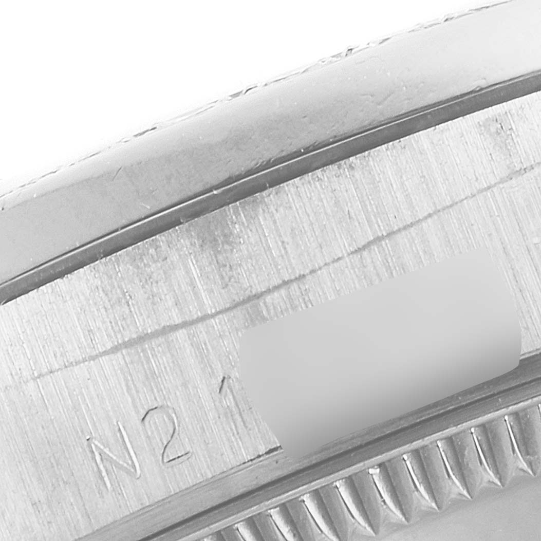 This close-up image shows part of the outer casing and edge of the bezel of a Rolex President 68286 Women's White Gold Silver Dial 68286 Women's White Gold Silver Dial model watch.