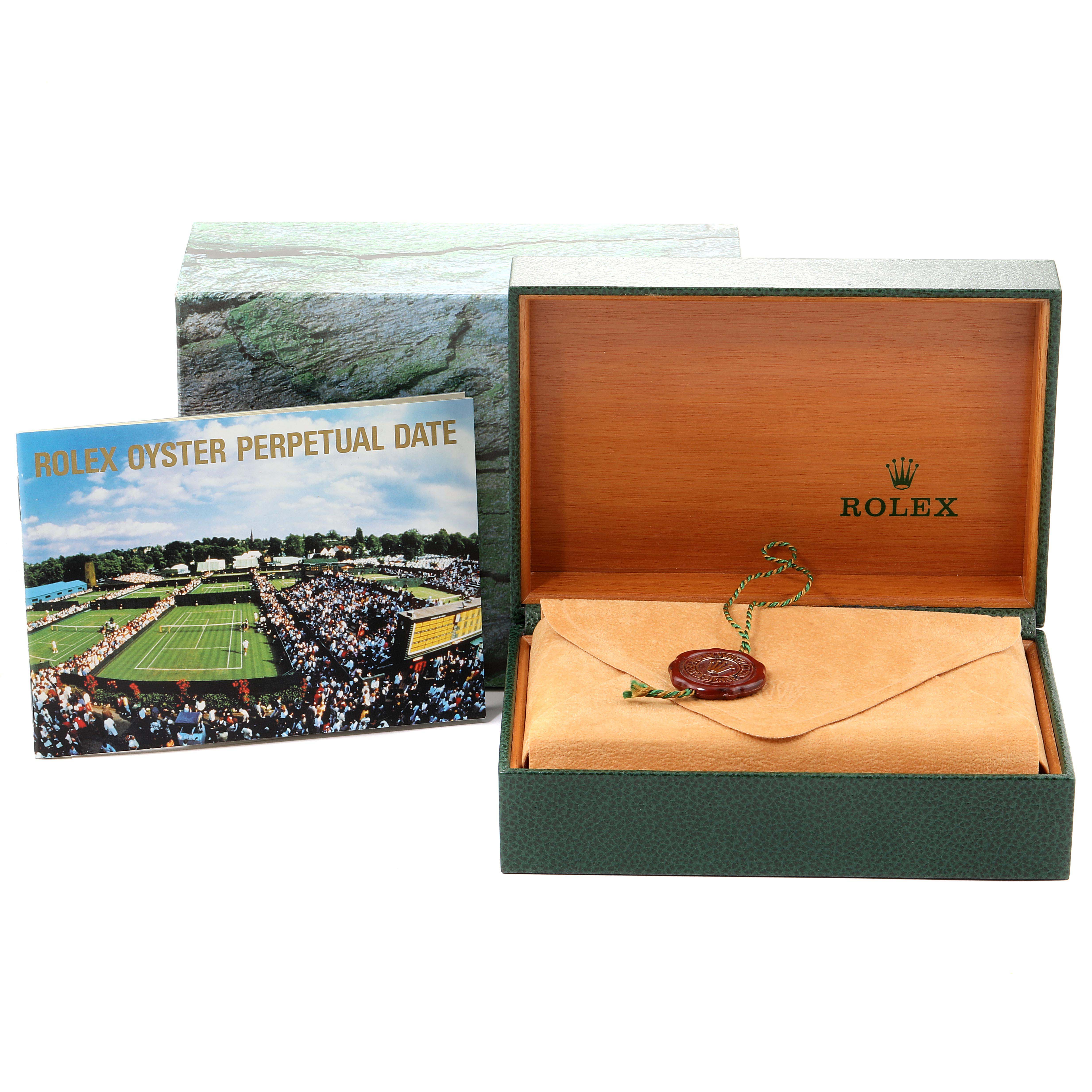 This image shows an open Rolex Date 15223 Men's Steel and Gold (two tone) Blue Dial 15223 Men's Steel and Gold (two tone) Blue Dial model box, a booklet, and a sealed envelope with a wax seal.