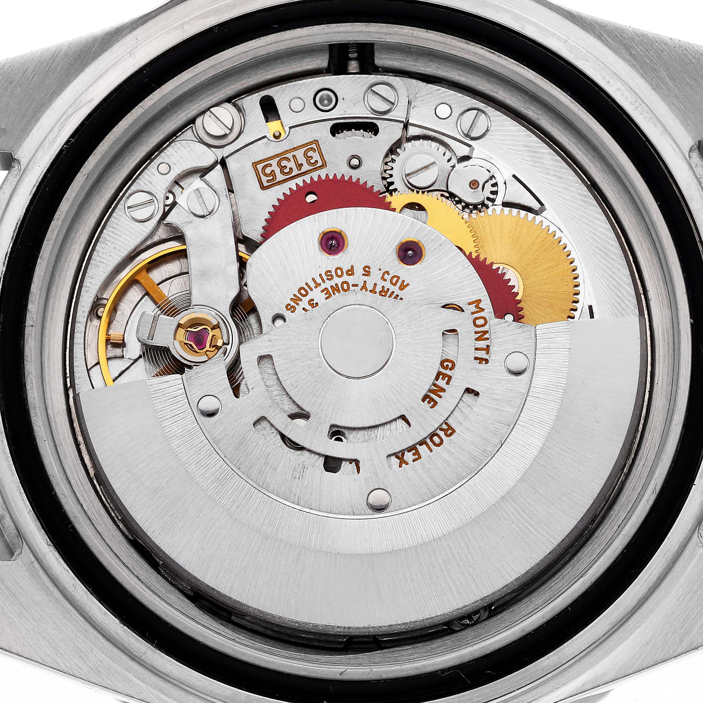 This image shows the internal mechanism of a Rolex Submariner 16610 Men
s Stainless Steel Black Dial 16610 Men
s Stainless Steel Black Dial watch from a back angle, displaying its intricate gears and movement parts.