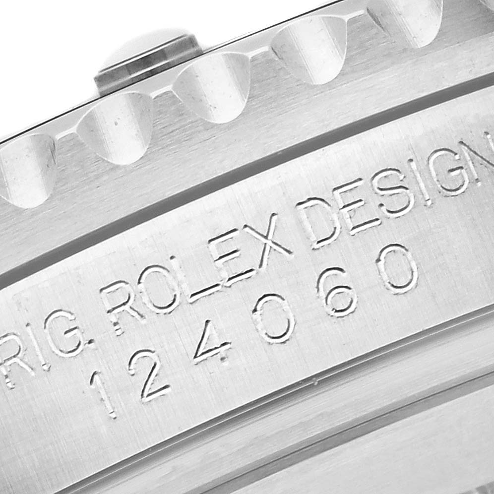 This close-up image of a Rolex Submariner 124060 Men
s Stainless Steel Black Dial 124060 Men
s Stainless Steel Black Dial displays the model number "124060" and part of the bezel from a side angle.