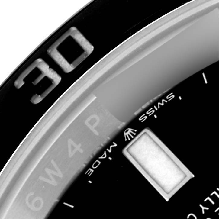 This image shows a close-up of the bezel and part of the dial on a Rolex Submariner 124060 Men
s Stainless Steel Black Dial 124060 Men
s Stainless Steel Black Dial watch.