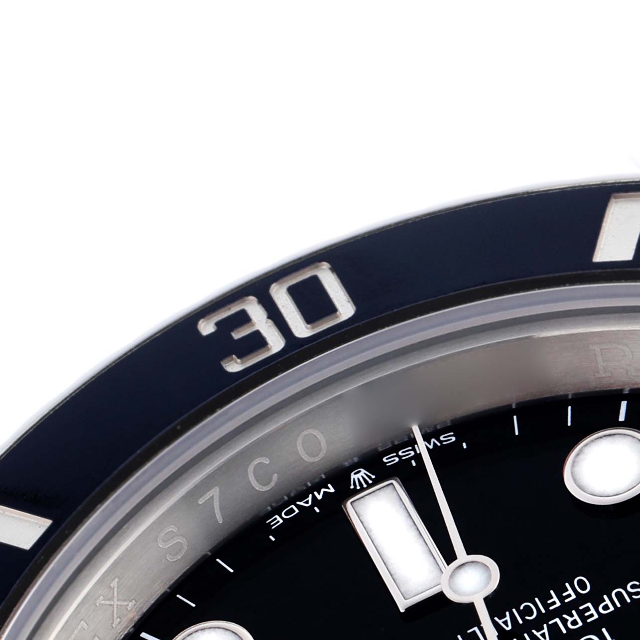 The image shows a close-up of the bezel and part of the dial of a Rolex Submariner 124060 Men
s Stainless Steel Black Dial 124060 Men
s Stainless Steel Black Dial watch, focusing on the 30-minute marker.