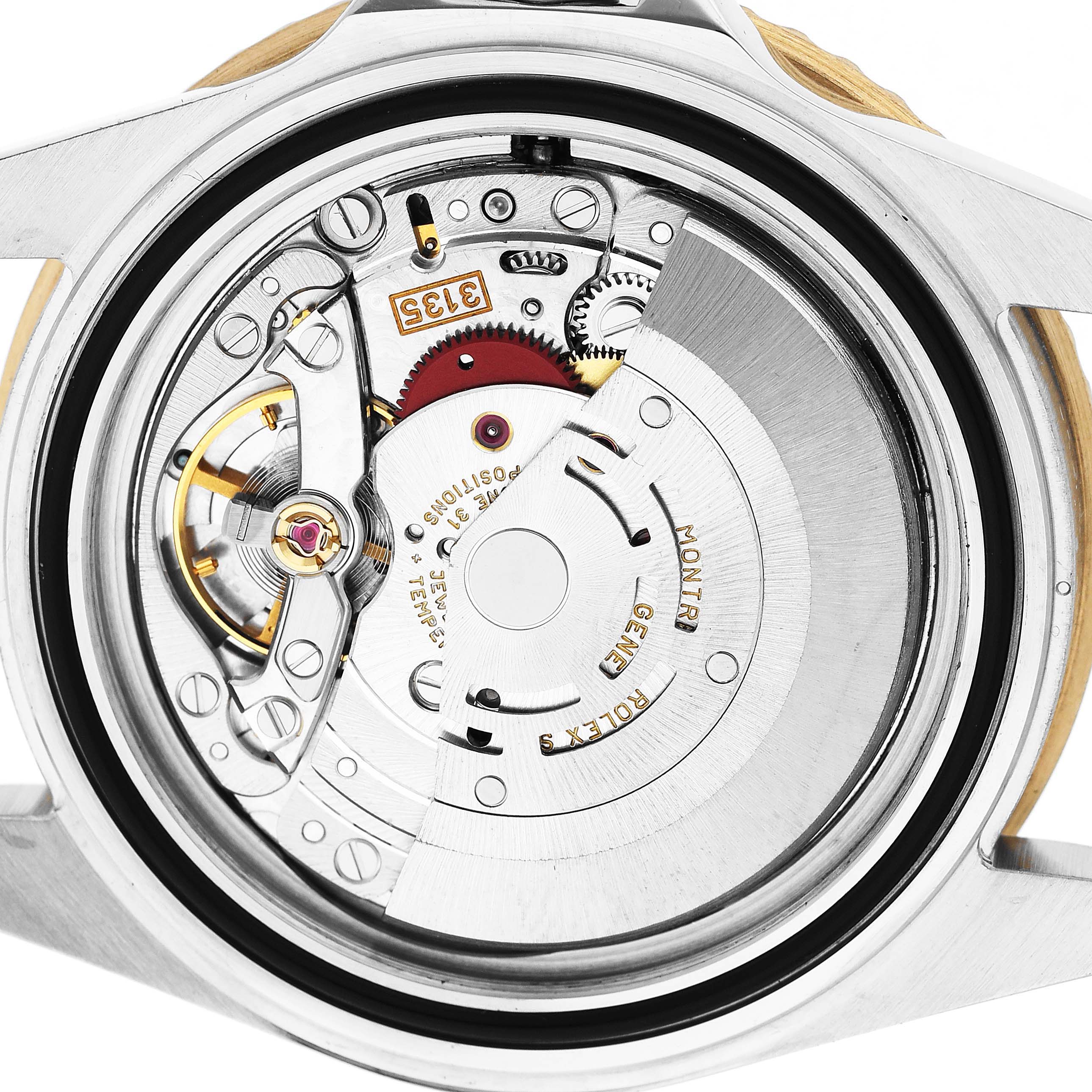 The image shows the movement mechanism of a Rolex Submariner 16613 Men's Steel and Gold (two tone) Black Dial, viewed from the back with intricate components visible.