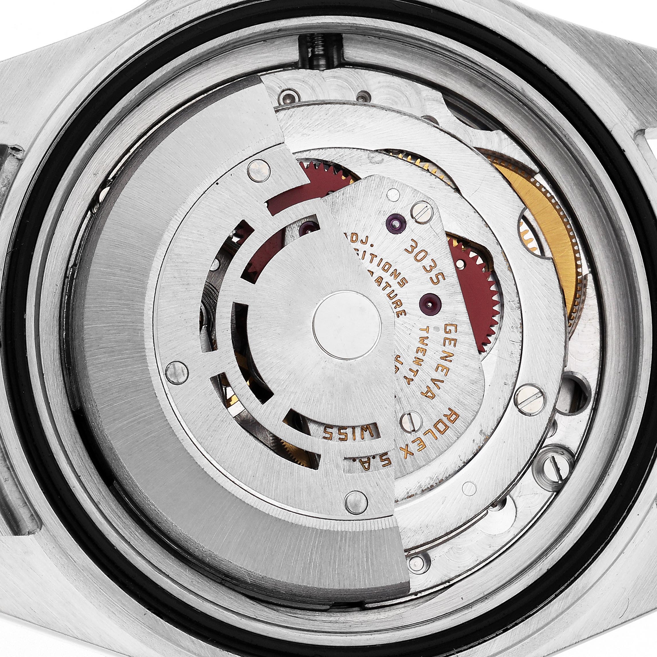 The image shows the movement of a Rolex Submariner 16803 Men
s Steel and Gold (two tone) Black Dial 16803 Men
s Steel and Gold (two tone) Black Dial watch, viewed from the back, highlighting its intricate mechanical parts.