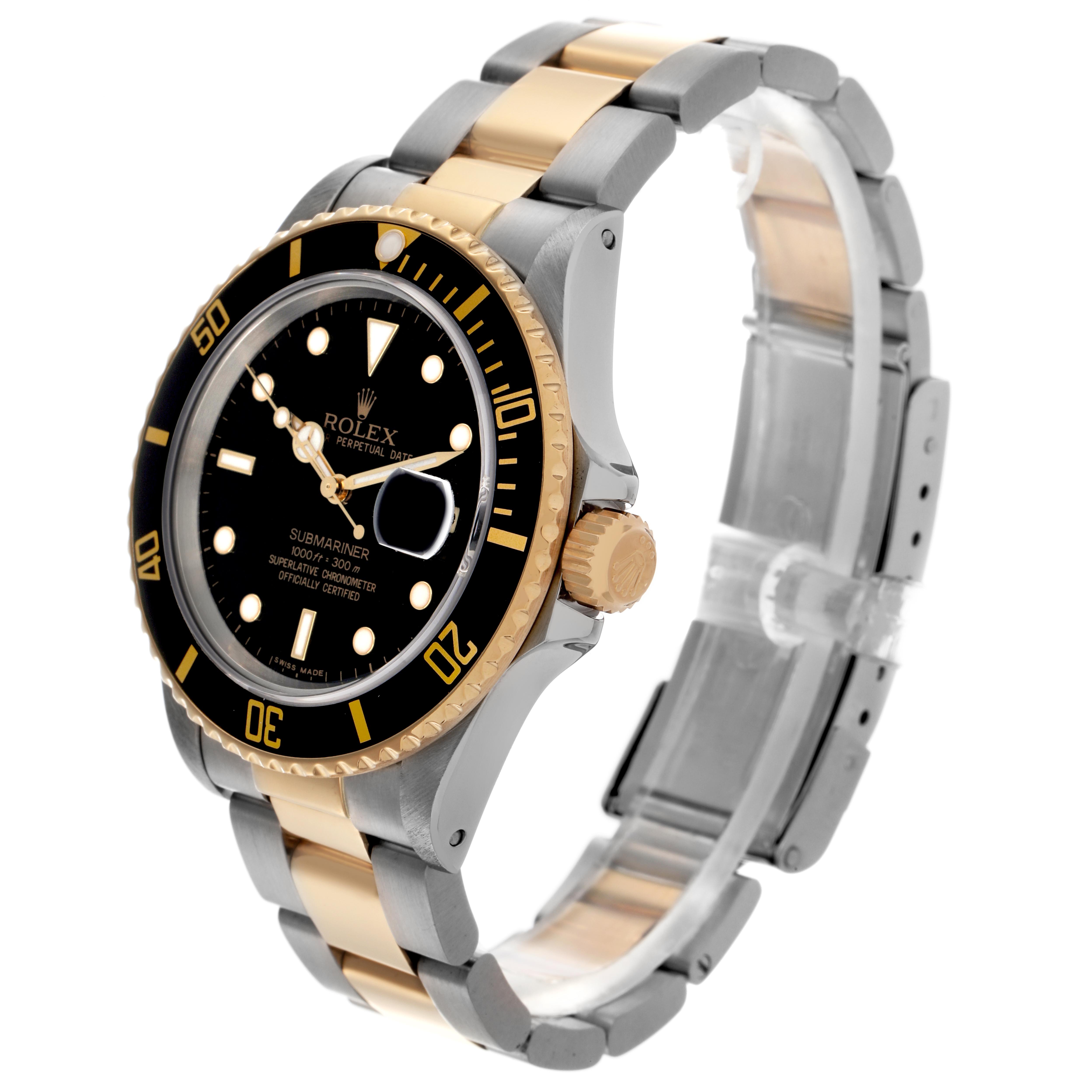 The Rolex Submariner 16803 Men
s Steel and Gold (two tone) Black Dial 16803 Men
s Steel and Gold (two tone) Black Dial is shown at a slight side angle highlighting the black dial, gold bezel, and two-tone bracelet.