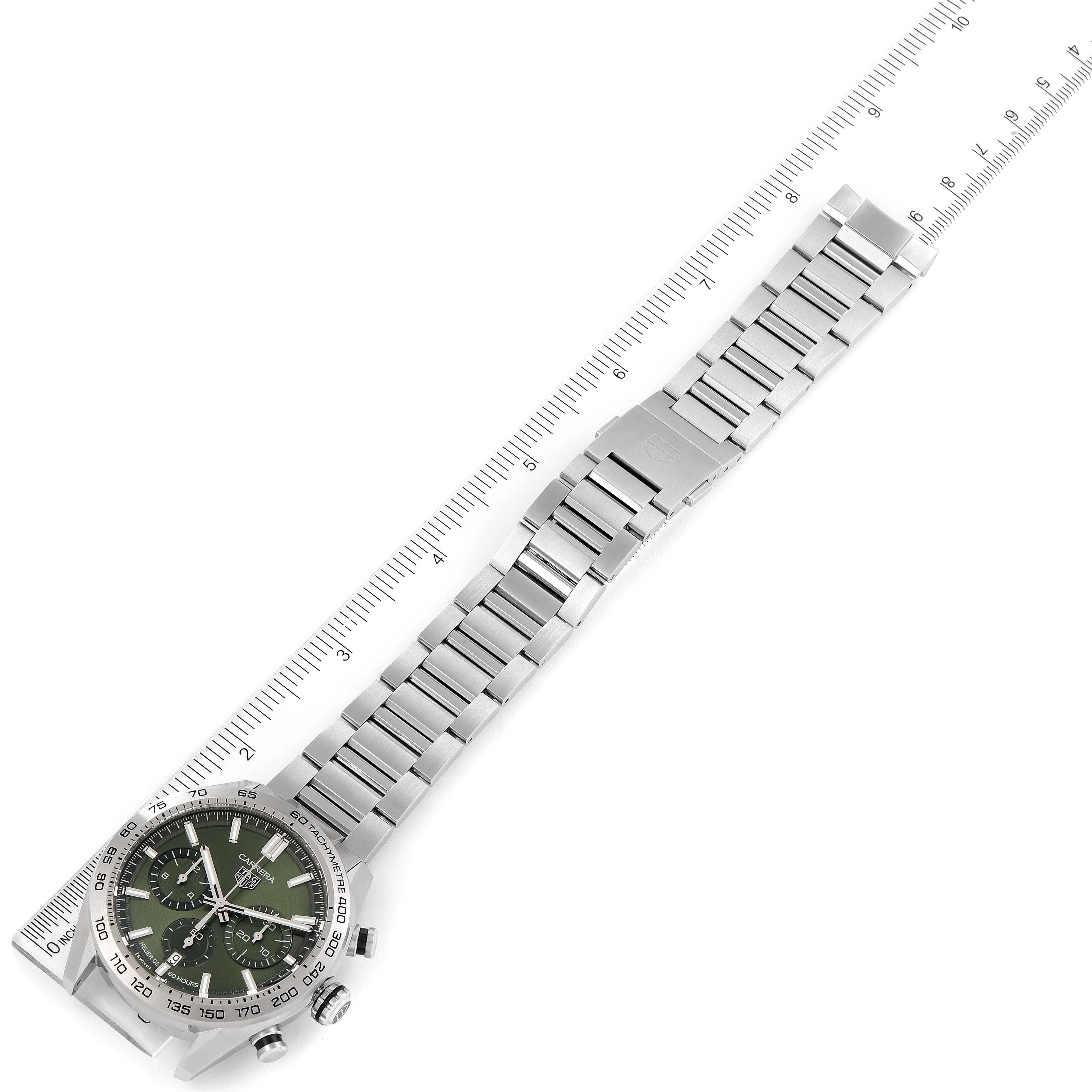 The Tag Heuer Carrera CBN2A10.BA0643 Men
s Stainless Steel Green Dial CBN2A10.BA0643 Men
s Stainless Steel Green Dial watch is shown at a tilted angle, displaying its metallic band, clasp, and part of the face with dials.