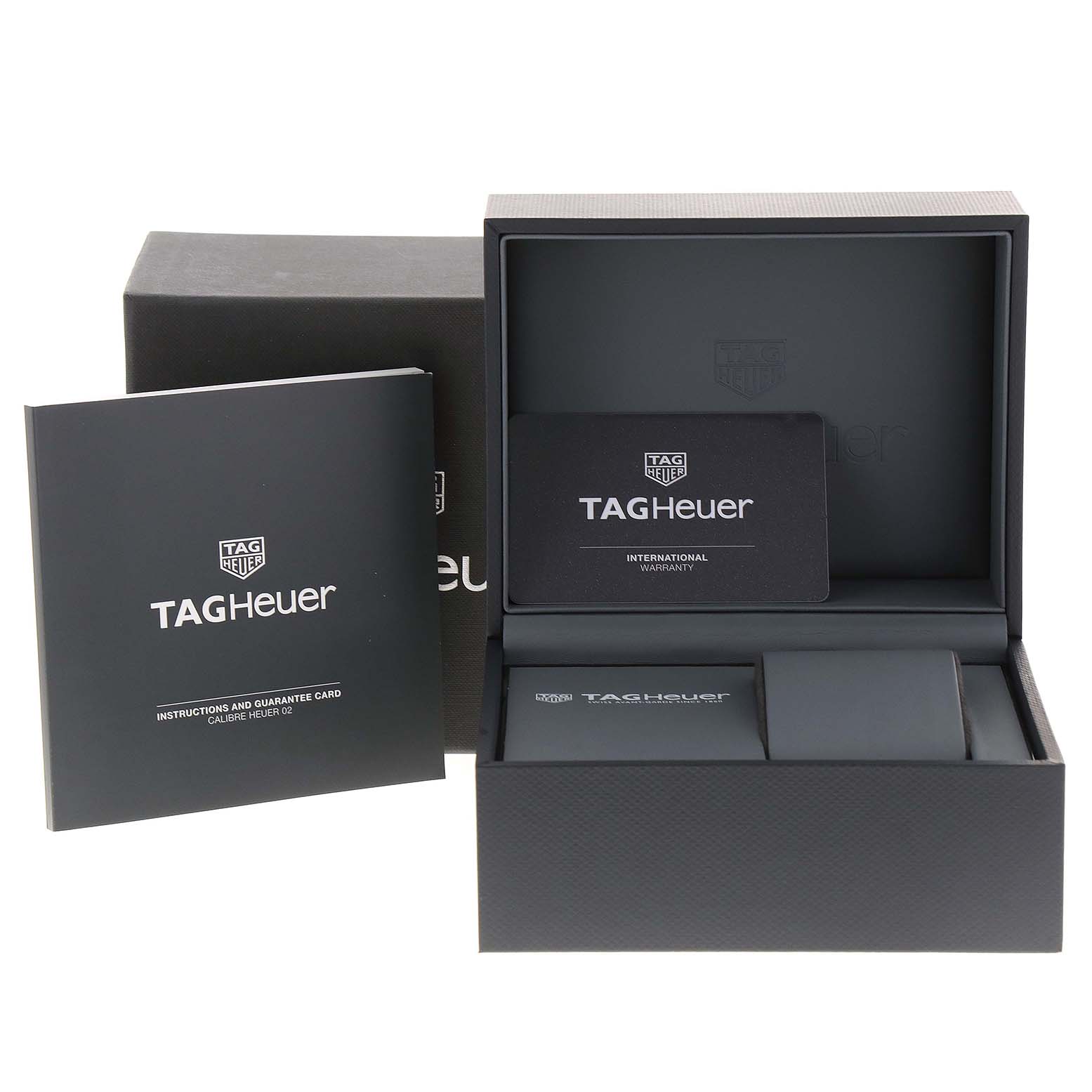 The image shows the packaging, instruction booklet, and warranty card for the Tag Heuer Carrera CBN2A10.BA0643 Men
s Stainless Steel Green Dial CBN2A10.BA0643 Men
s Stainless Steel Green Dial model.