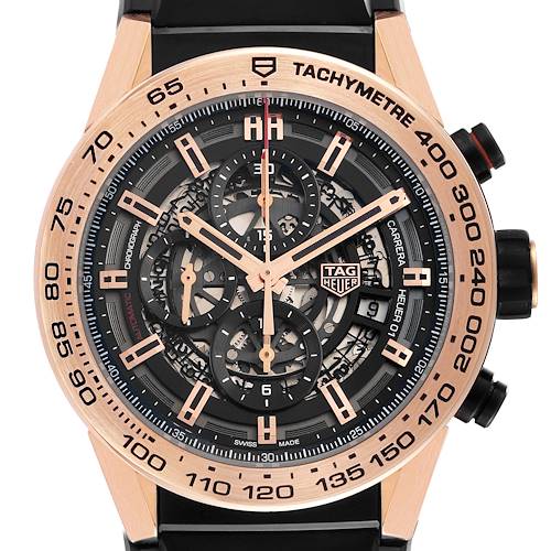 The image shows a detailed front view of the Tag Heuer Carrera CAR2A5B.FT6044 Men's Rose Gold Black Dial watch, highlighting its intricate dial, tachymeter, and chronograph features.