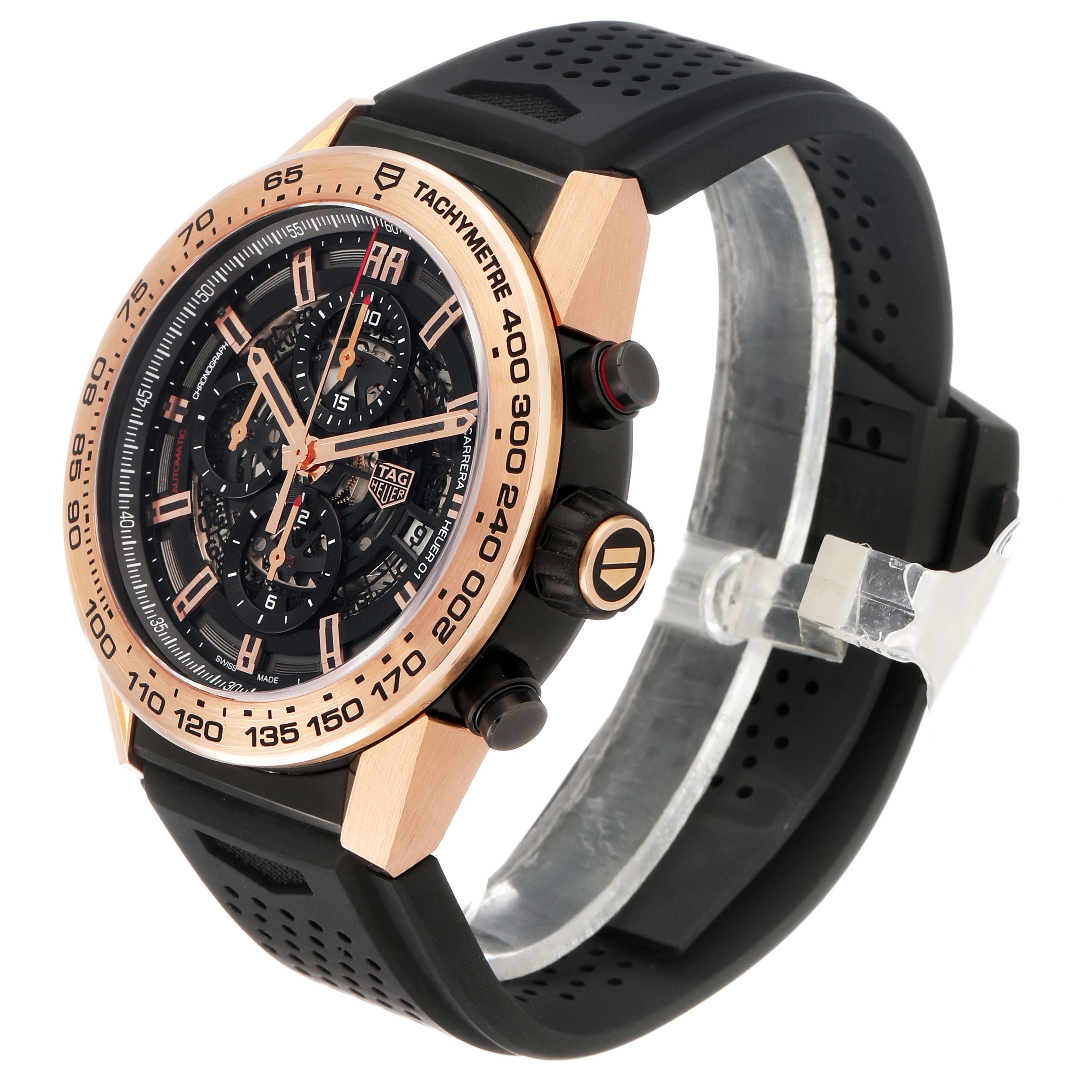 The Tag Heuer Carrera CAR2A5B.FT6044 Men's Rose Gold Black Dial watch is shown at an angled side view, displaying its black dial, rose gold bezel, and black strap.