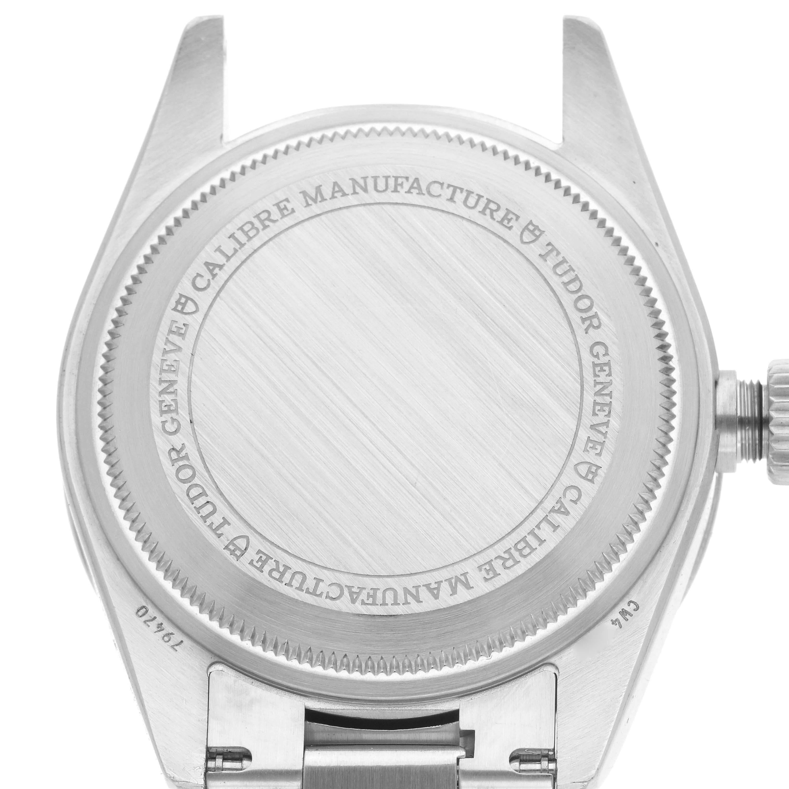 The image shows the back case and crown of the Tudor Heritage Black Bay 79470 Men
s Stainless Steel Black Dial 79470 Men
s Stainless Steel Black Dial watch, viewed from behind.