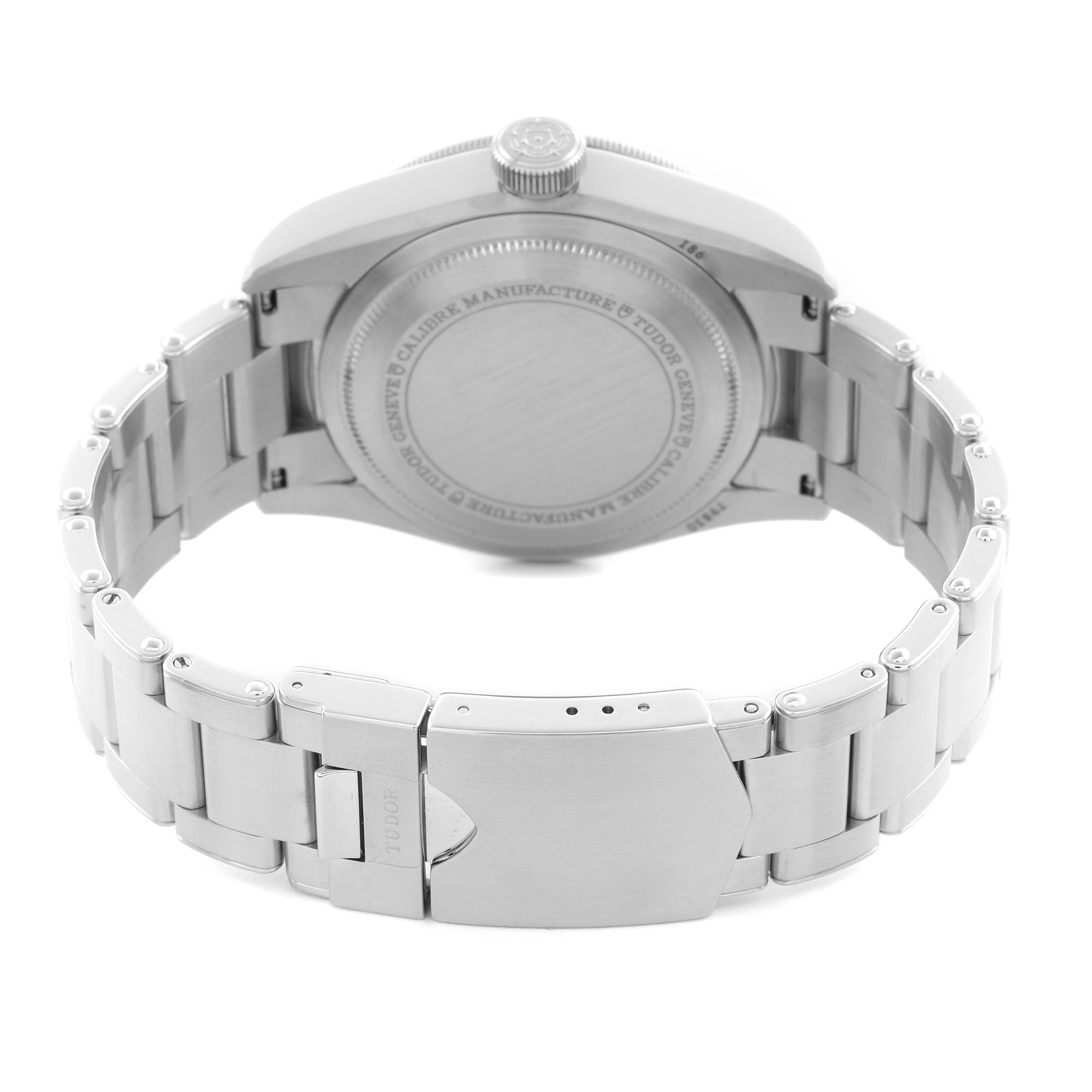 The image shows the back of the Tudor Heritage Black Bay 79830RB Men
s Stainless Steel Black Dial 79830RB Men
s Stainless Steel Black Dial watch, highlighting the case back, crown, and metal bracelet with a clasp.