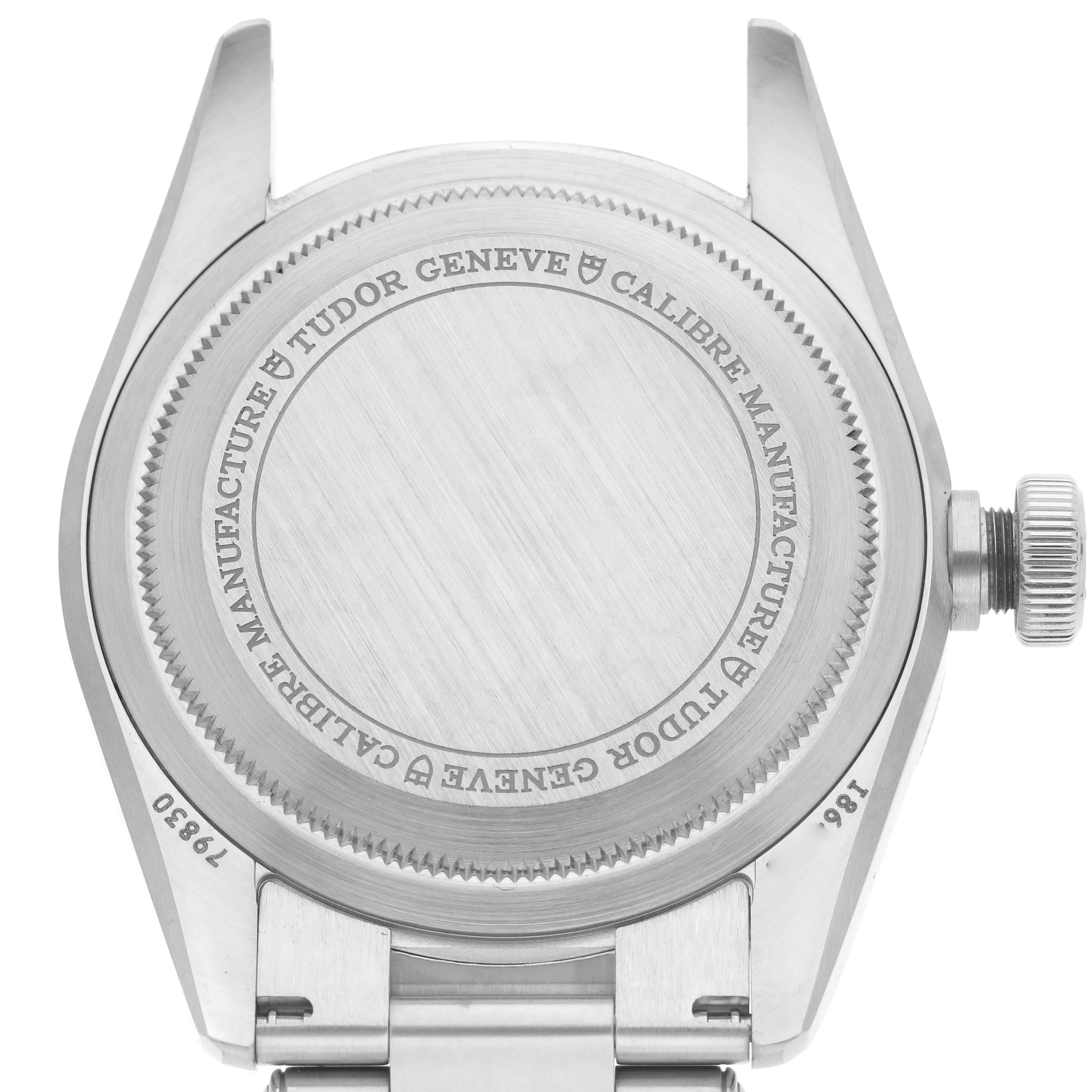 The image shows the back case and crown of a Tudor Heritage Black Bay 79830RB Men
s Stainless Steel Black Dial 79830RB Men
s Stainless Steel Black Dial watch from a rear angle.