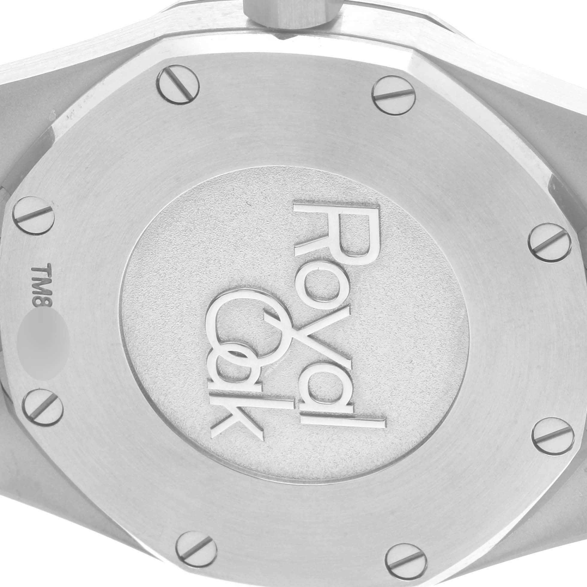 The image shows the back case of an Audemars Piguet Royal Oak 67650ST.OO.1261ST.01 Women's Stainless Steel Black Dial 67650ST.OO.1261ST.01 Women's Stainless Steel Black Dial watch, highlighting the engraved logo and screws.