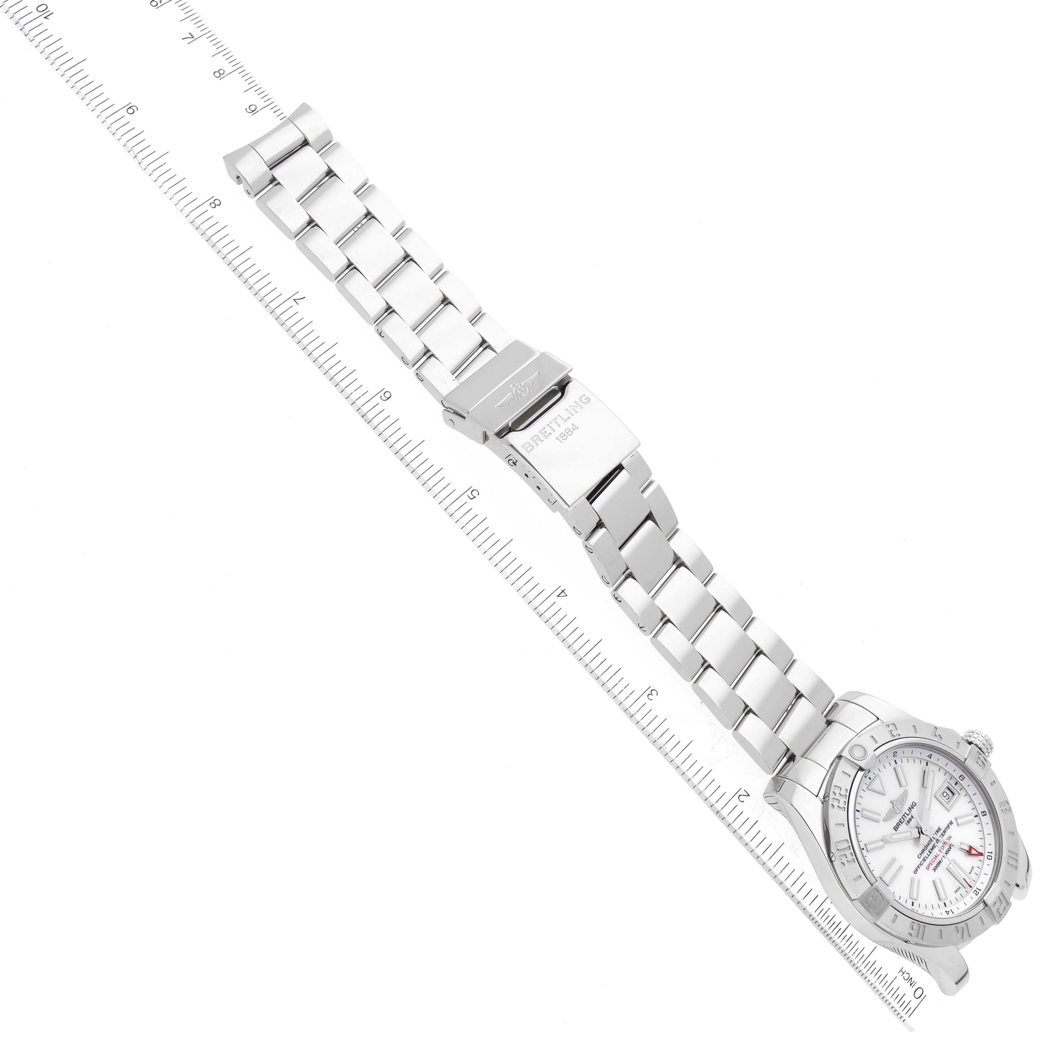 The image shows a Breitling Avenger A32390 Men's Stainless Steel Mother of Pearl Dial A32390 Men's Stainless Steel Mother of Pearl Dial watch laid flat, with its bracelet extended and measured against a ruler.
