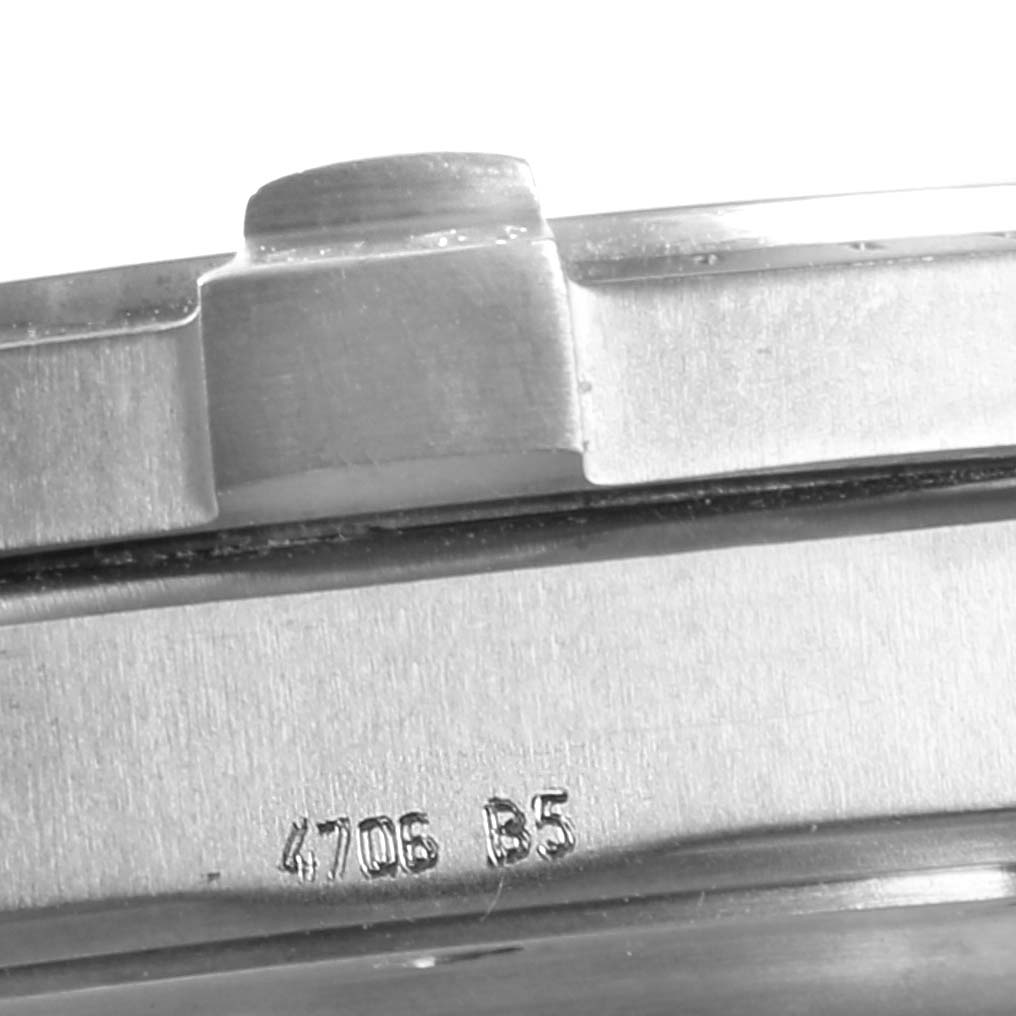 The image shows a close-up of the casing and engraved serial number on a Breitling Professional Series E7936210 Men's Titanium Silver Dial E7936210 Men's Titanium Silver Dial watch.