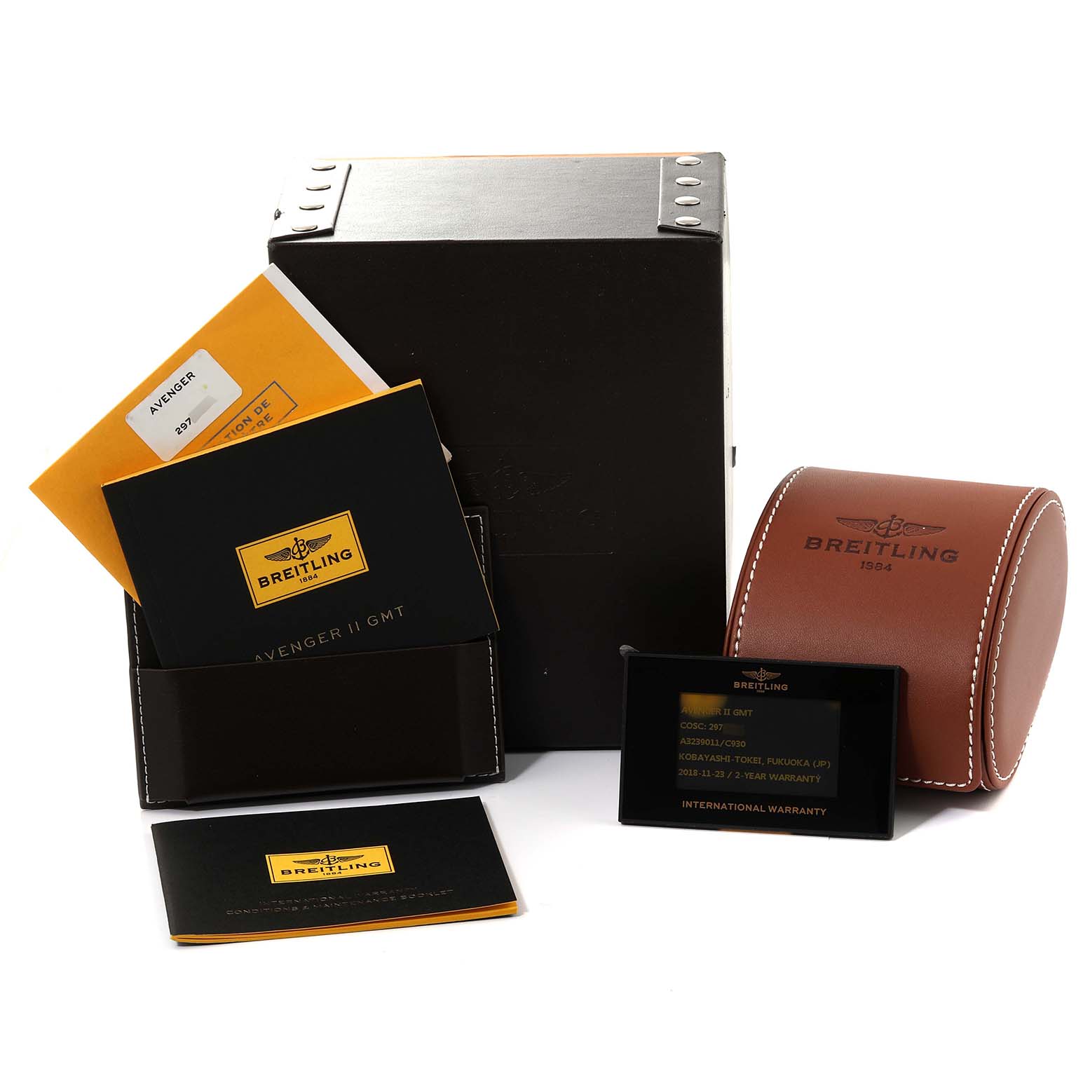 The image shows the packaging and accessories for a Breitling Avenger A3239011/C930 Men's Stainless Steel Mother of Pearl Dial A3239011/C930 Men's Stainless Steel Mother of Pearl Dial watch, including manuals, warranty card, and a leather case.