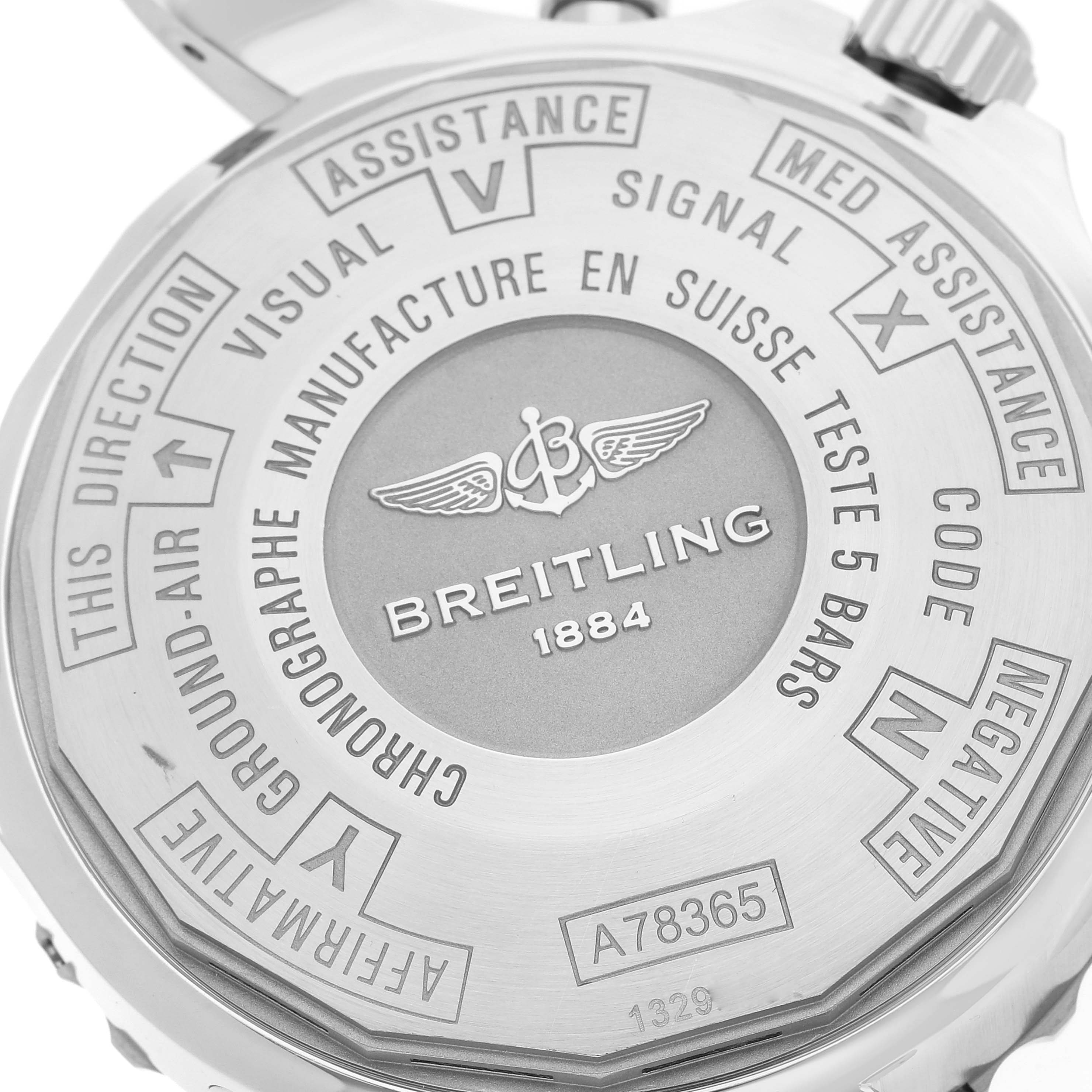 The image shows the back case of a Breitling Professional Series A78365 Men's Stainless Steel Silver Dial A78365 Men's Stainless Steel Silver Dial watch, displaying brand markings and engraved instructions.