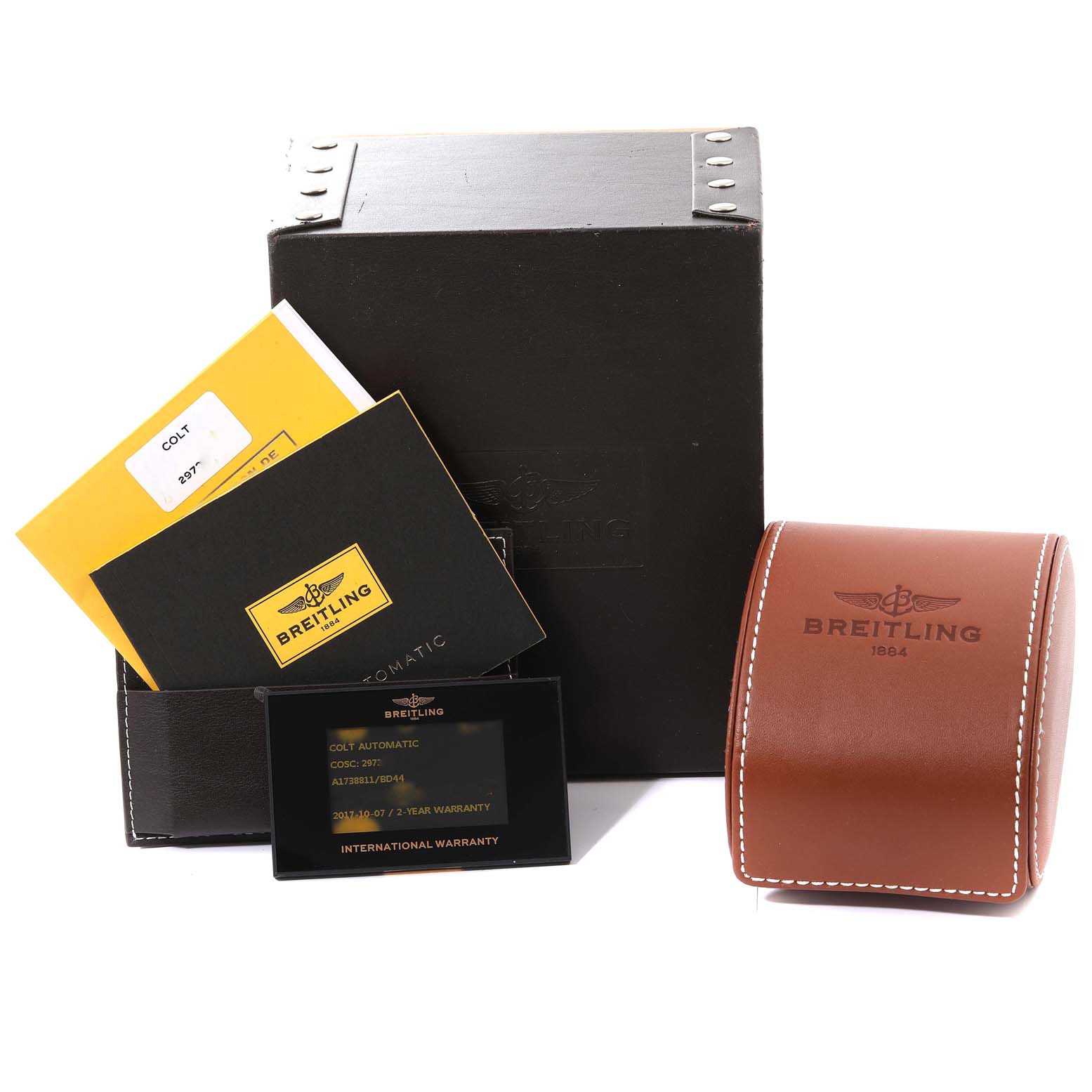 The image shows the Breitling Colt A1738811/BD44 Men's Stainless Steel Black Dial A1738811/BD44 Men's Stainless Steel Black Dial watch accessories, including manuals, a warranty card, a watch box, and a leather travel case.