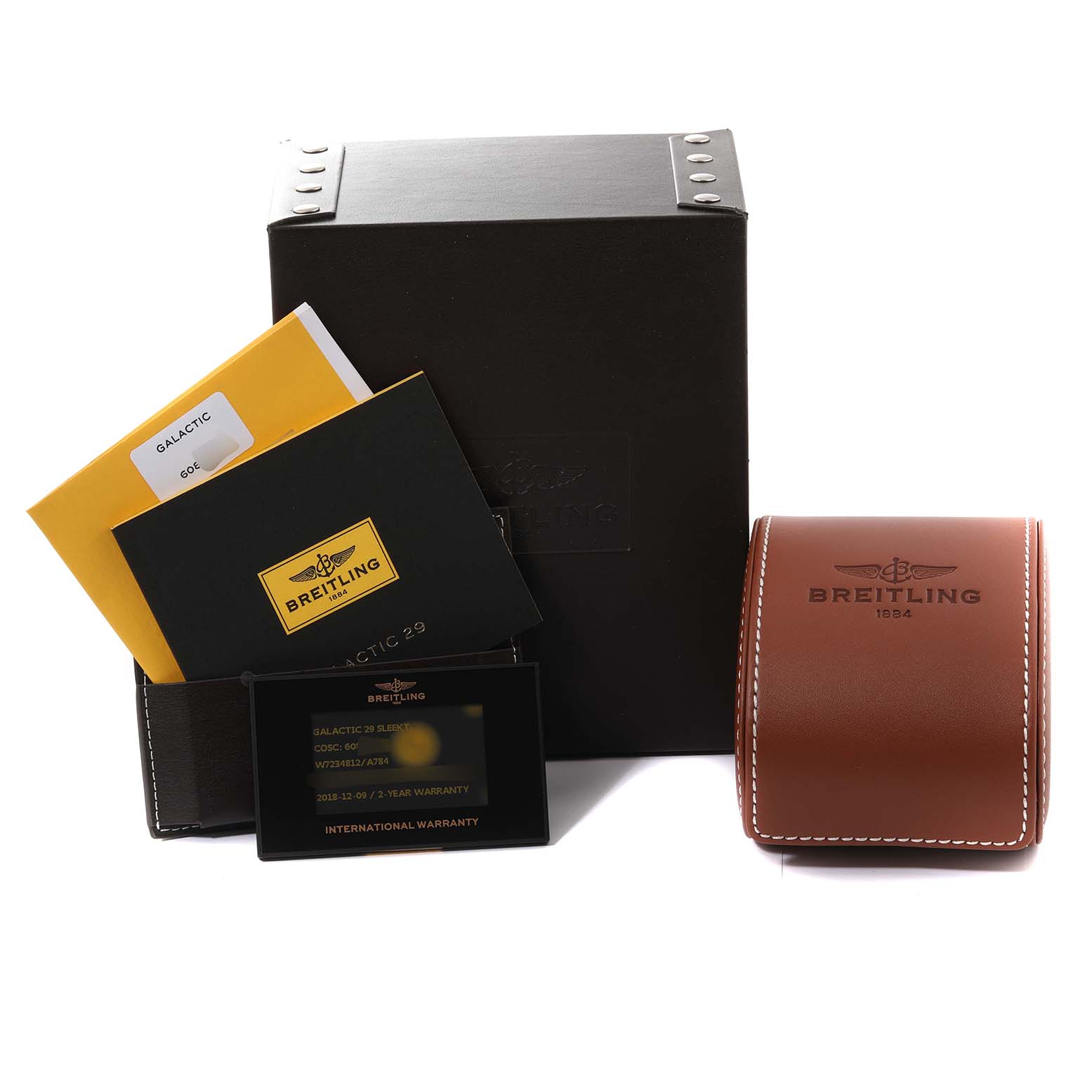 The image shows the packaging and accessories of the Breitling W7234812/A784 Women
s Stainless Steel Mother of Pearl Dial W7234812/A784 Women
s Stainless Steel Mother of Pearl Dial Galactic 29 Ladies Watch, including boxes, booklets, and a warranty card.