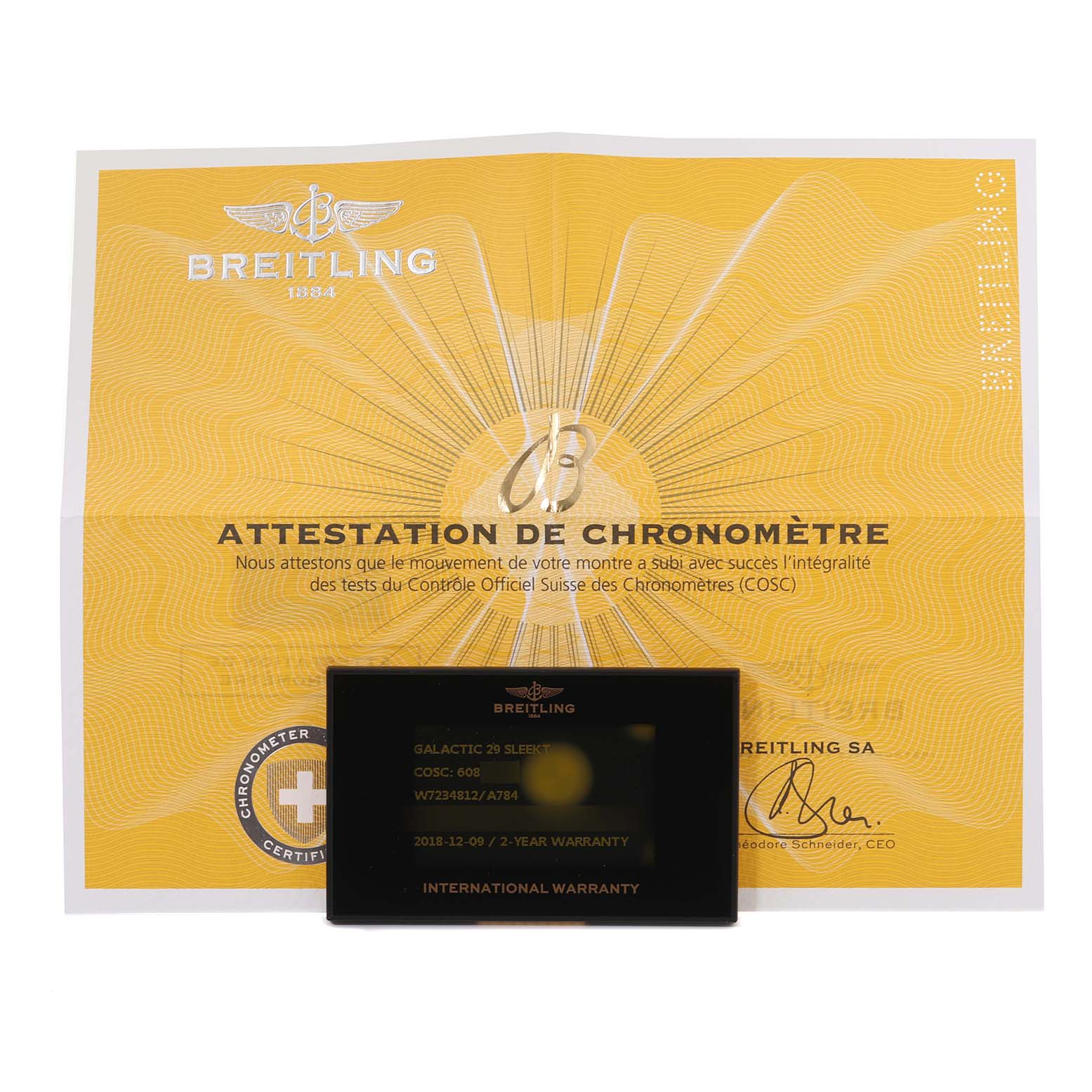 The image shows the documentation, including the warranty card and certificate, for the Breitling W7234812/A784 Women
s Stainless Steel Mother of Pearl Dial W7234812/A784 Women
s Stainless Steel Mother of Pearl Dial Galactic 29 Mother of Pearl Dial Steel Ladies Watch W72348.