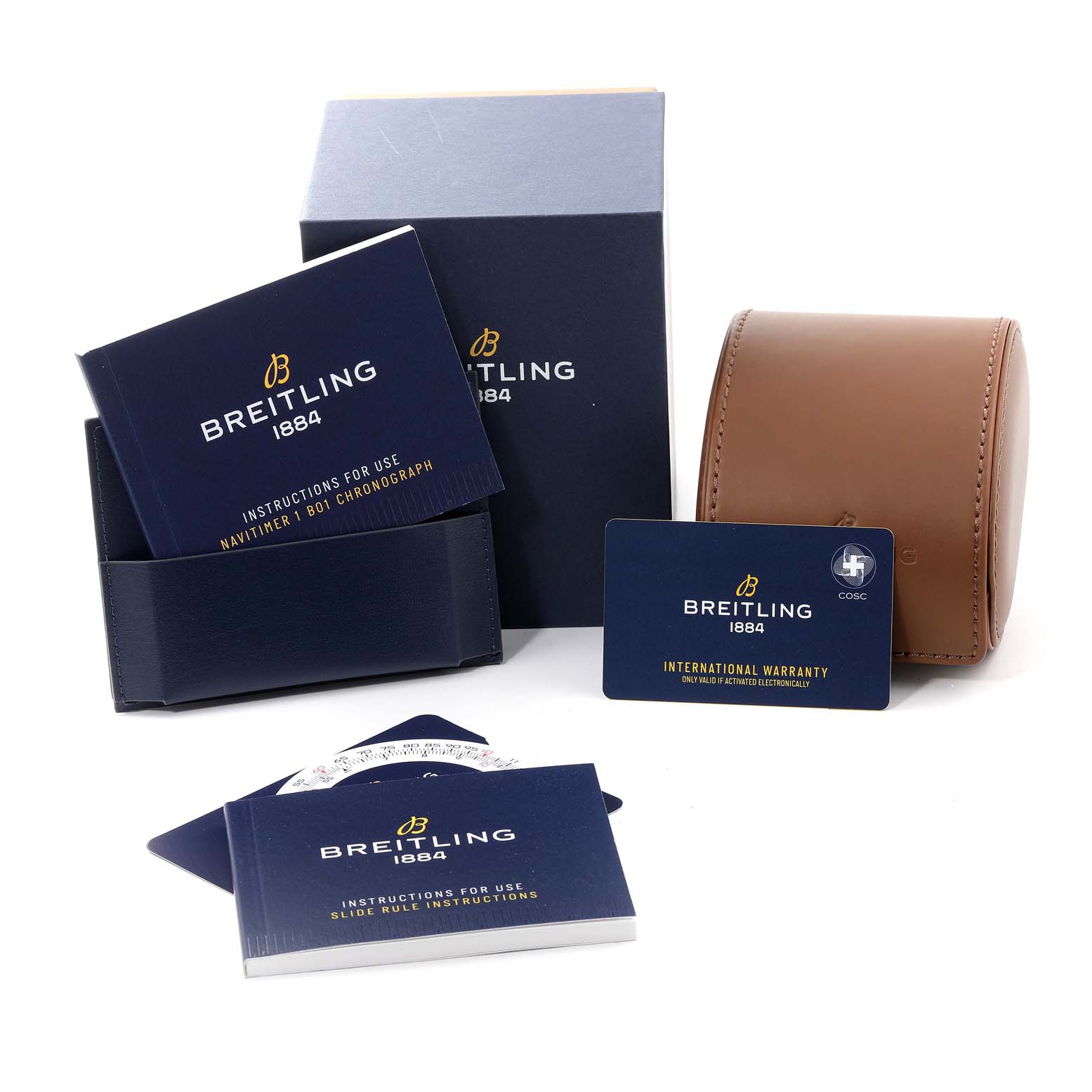 The image shows Breitling Navitimer AB0121 Men's Stainless Steel Black Dial AB0121 Men's Stainless Steel Black Dial model accessories, including instruction booklets, an international warranty card, and a brown leather case.