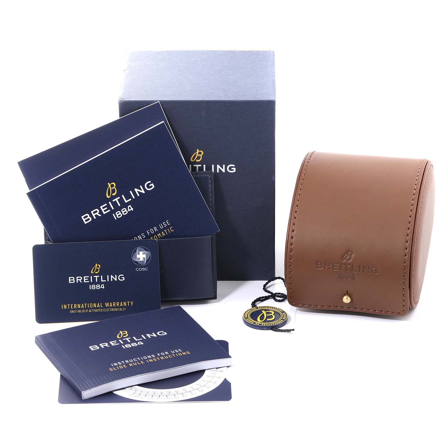 The image shows accessories for a Breitling Navitimer U17326211M1A1 Men
s Steel and Gold (two tone) Grey Dial U17326211M1A1 Men
s Steel and Gold (two tone) Grey Dial, including a box, manuals, warranty card, and leather watch case.