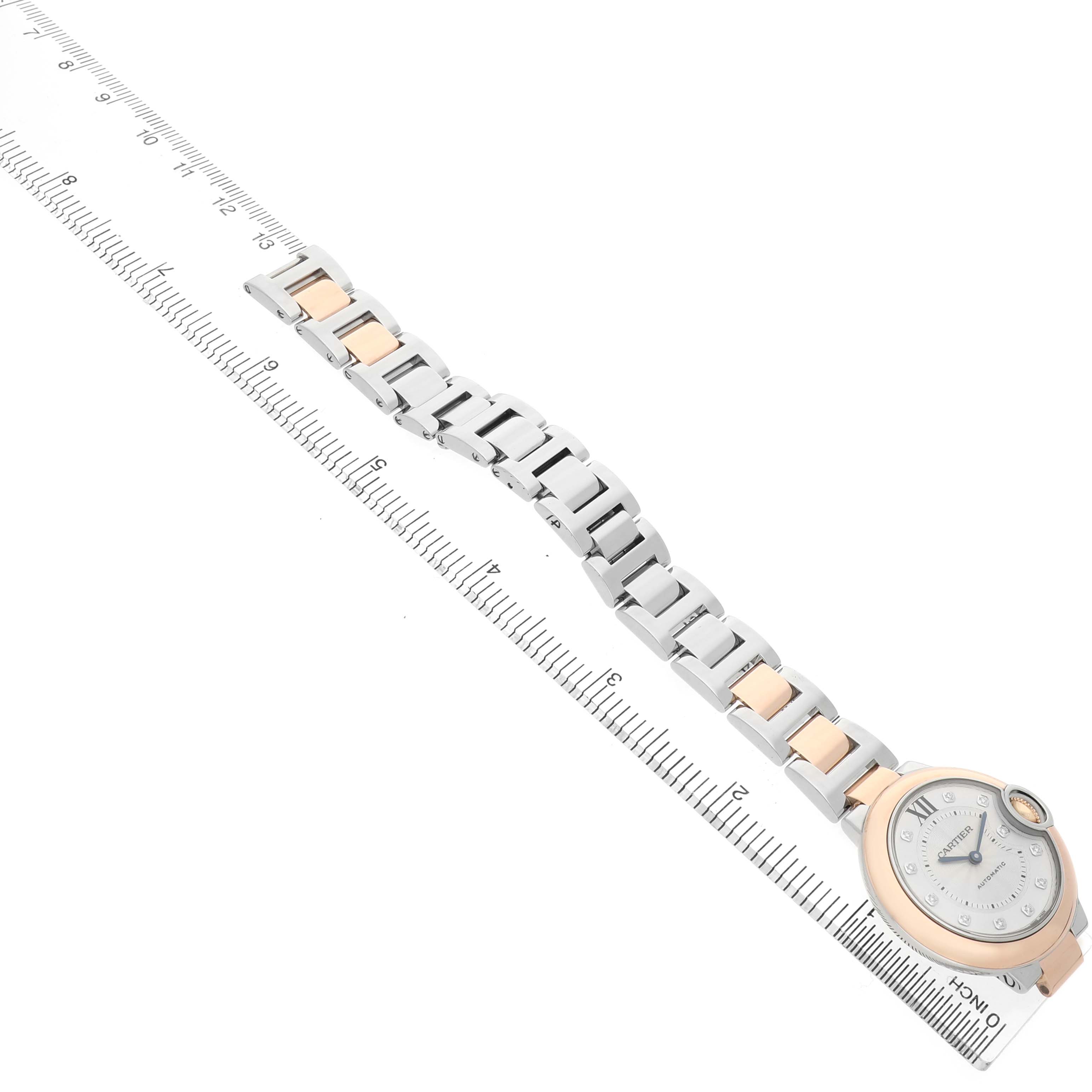 The image shows a top view of a Cartier Ballon Bleu W3BB0006 Women's Steel and Gold (two tone) Silver Dial watch, highlighting its round case and two-tone bracelet.