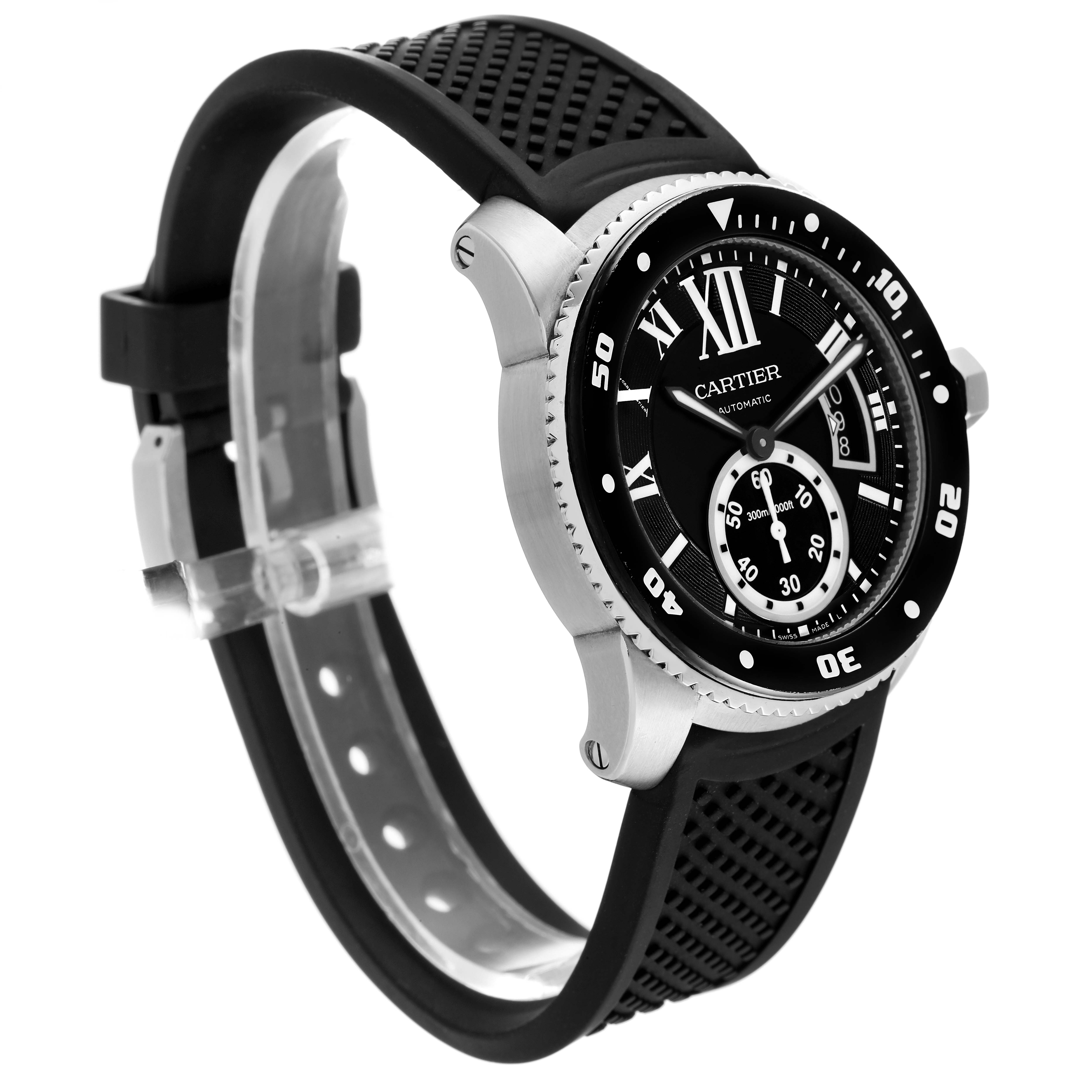 The Calibre de Cartier watch by Cartier is shown at a three-quarter angle, highlighting its watch face, bezel, and black rubber strap.