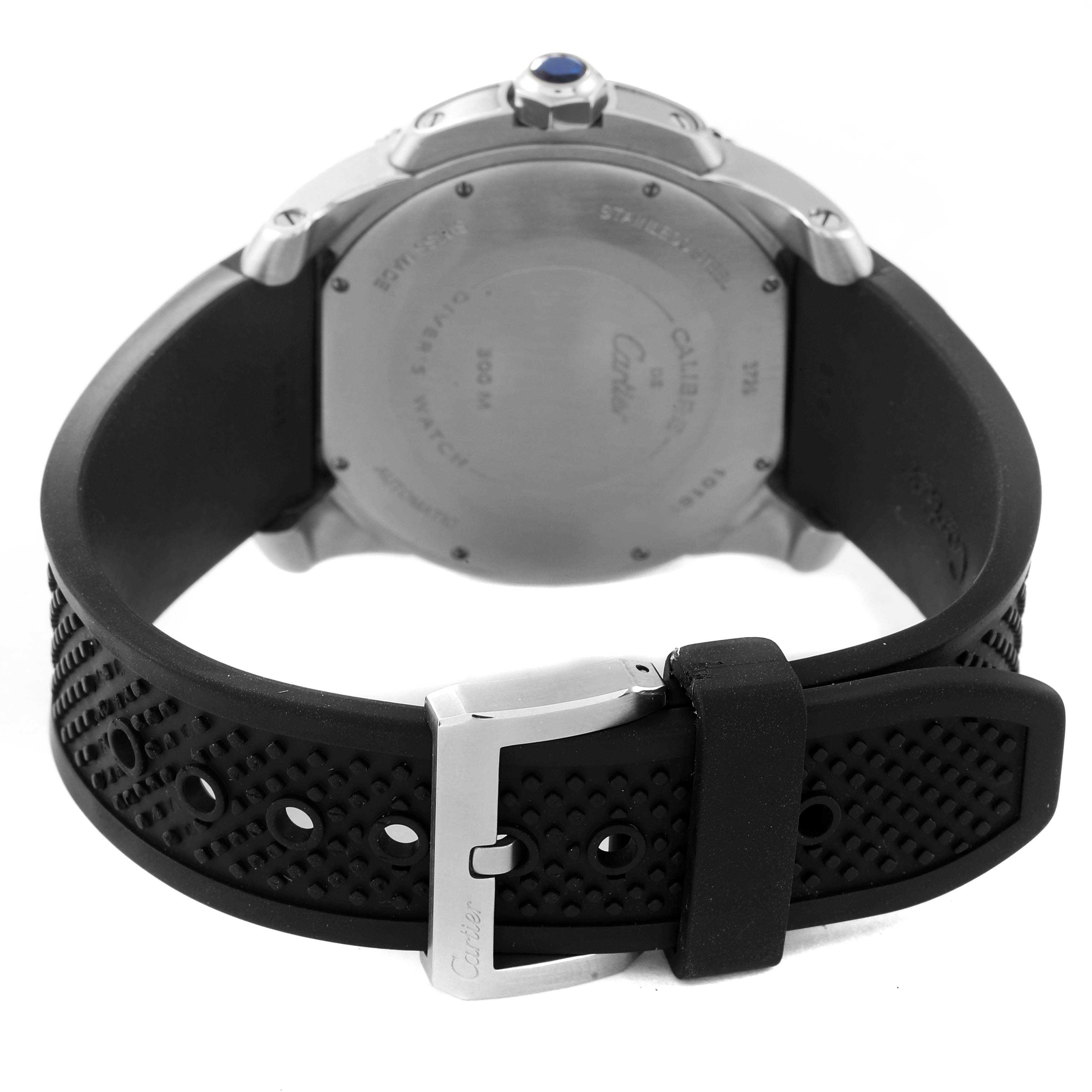 The image shows the back and strap of a Calibre de Cartier watch by Cartier, focusing on the case back and buckle.