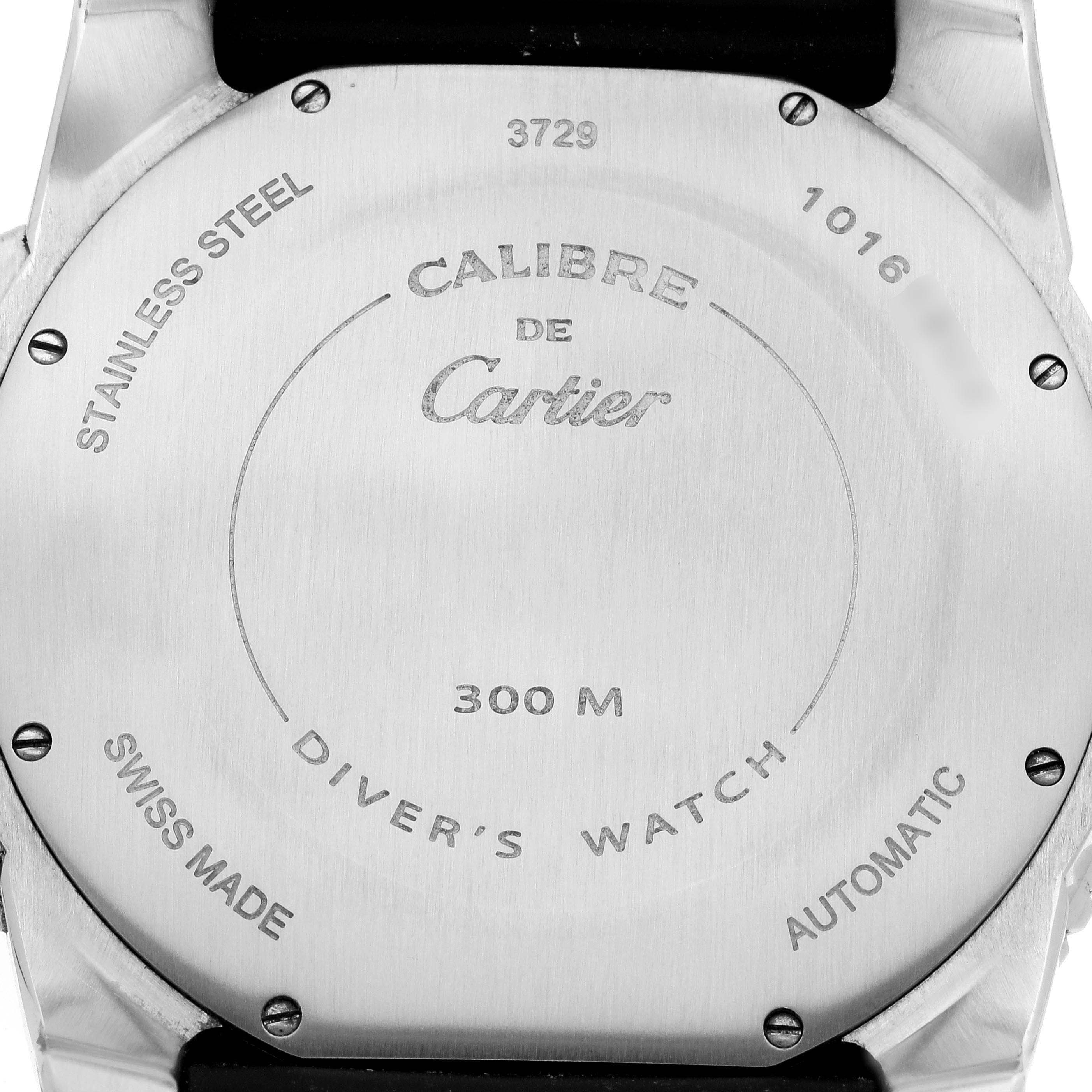 The image shows the back of the Calibre de Cartier watch by Cartier, featuring engravings and specifications.