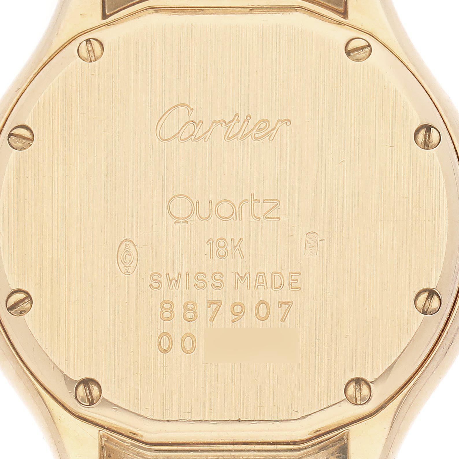The image shows the back case of a Cartier Panthere WF8002B9 Women
s Yellow Gold Silver Dial WF8002B9 Women
s Yellow Gold Silver Dial watch, highlighting its engravings and screws.