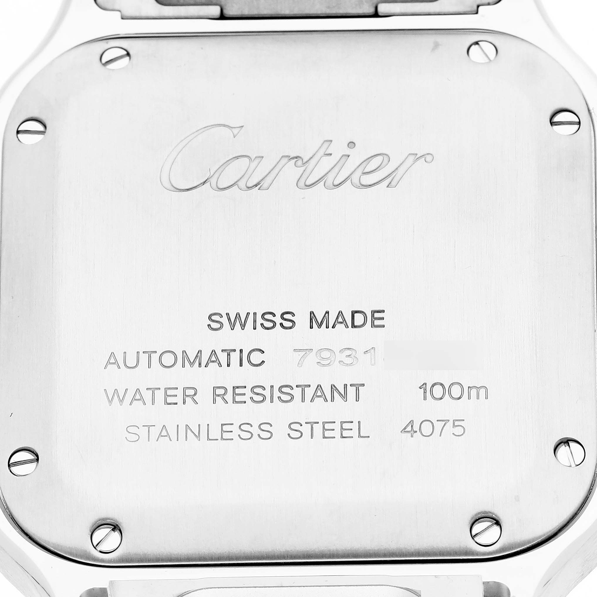 The image shows the case back of a Cartier Santos WSSA0029 Men's Stainless Steel Silver Dial watch, highlighting the engraved brand details and technical specifications.