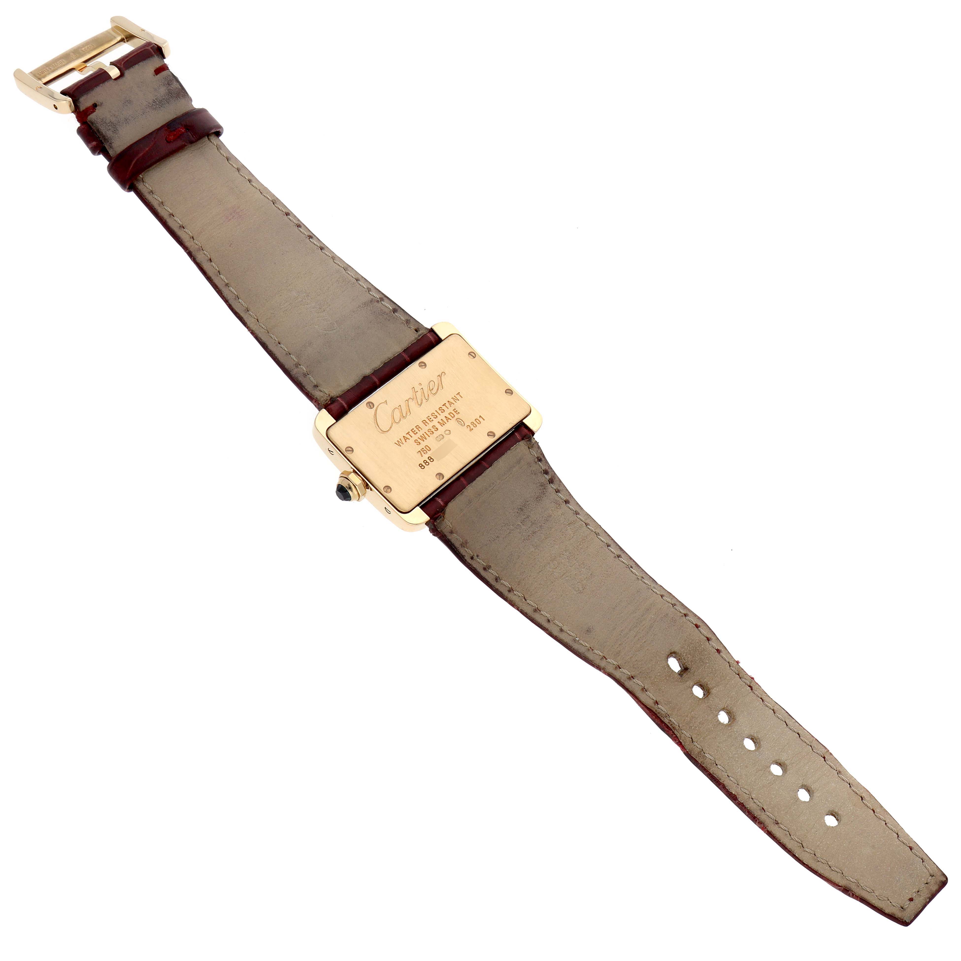 The image shows the back view of a Tank Divan model by Cartier, displaying the strap and case back.